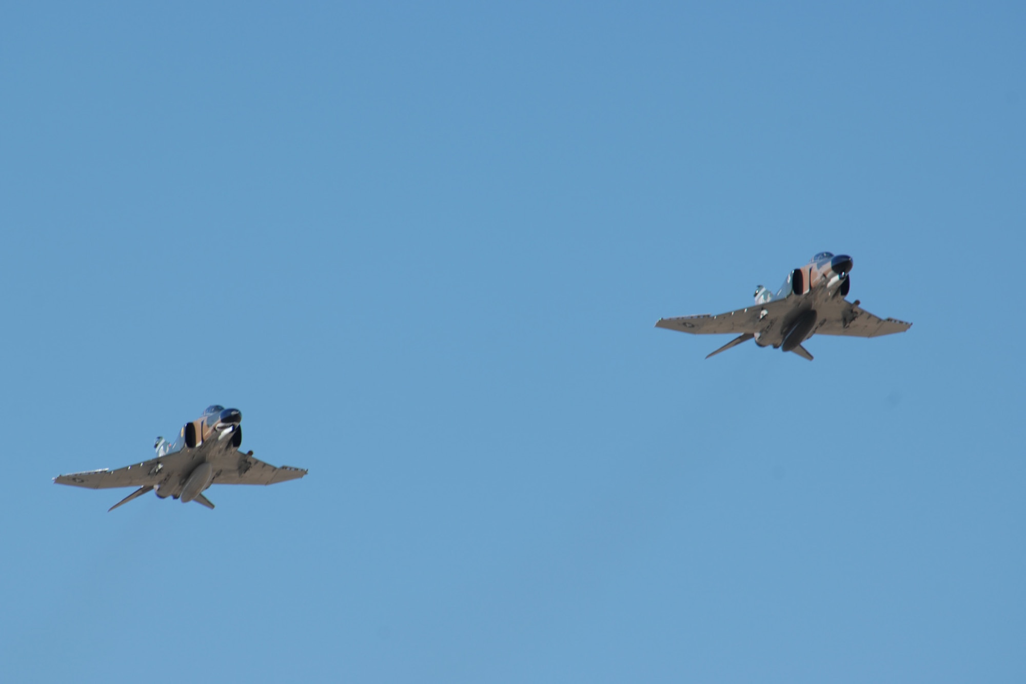 Brig. Gen. David Goldfein, 49th Fighter Wing commander, and Lt. Col. Joel Rush, Detachment 1, 82nd Aerial Targets Squadron commander, fly F-4 Phantoms over the skies of Holloman Air Force Base, N.M., Dec. 20, 2007. The Phantom was designed and manufactured by the McDonnell Douglas aviation company. (U.S. Air Force photo/Airman 1st Class Jamal D. Sutter)