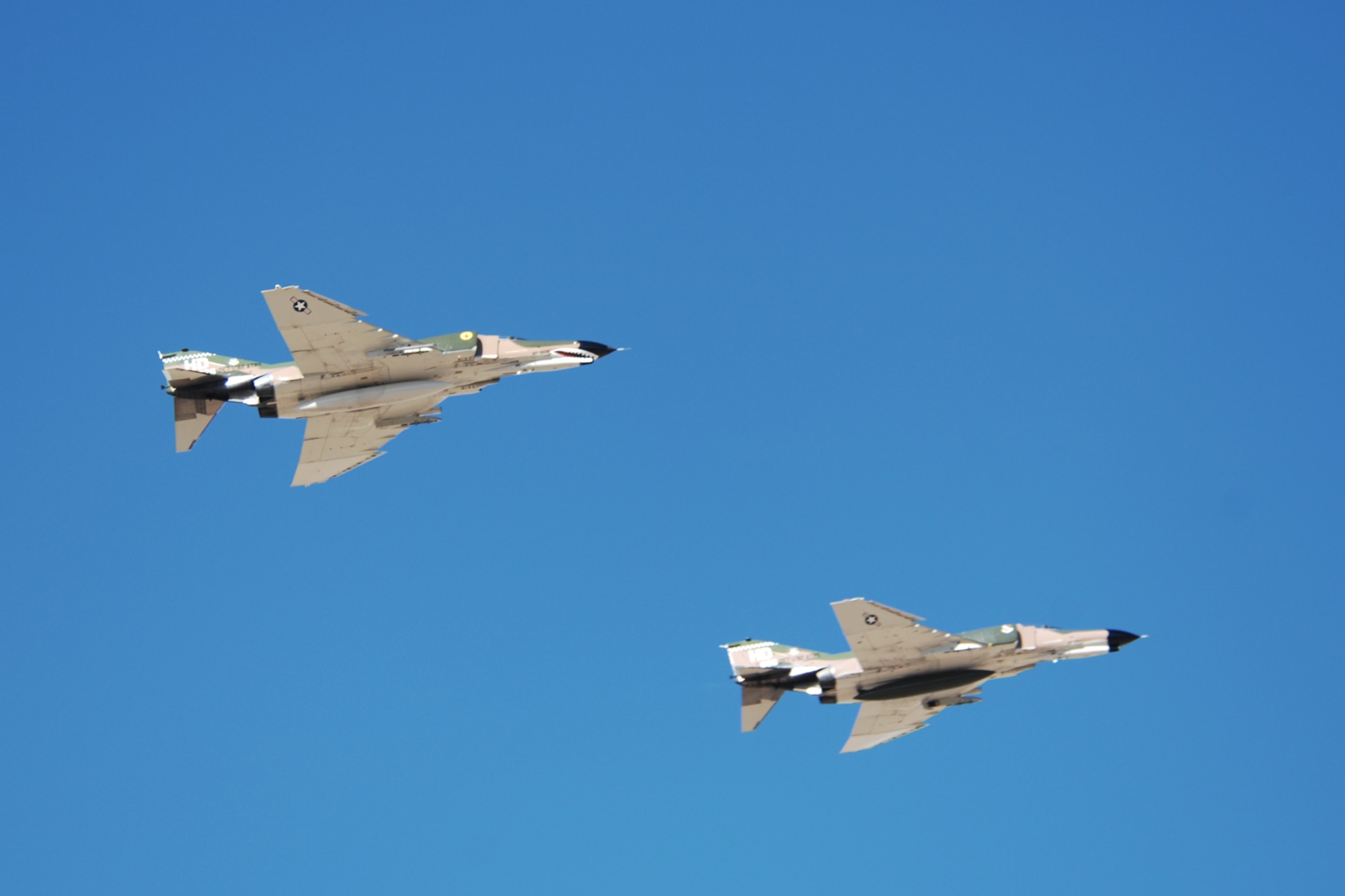 Brig. Gen. David Goldfein, 49th Fighter Wing commander, and Lt. Col. Joel Rush, Detachment 1, 82nd Aerial Targets Squadron commander, fly F-4 Phantoms over the skies of Holloman Air Force Base, N.M., Dec. 20, 2007. The Phantom was designed and manufactured by the McDonnell Douglas aviation company. (U.S. Air Force photo/Airman 1st Class Jamal D. Sutter)