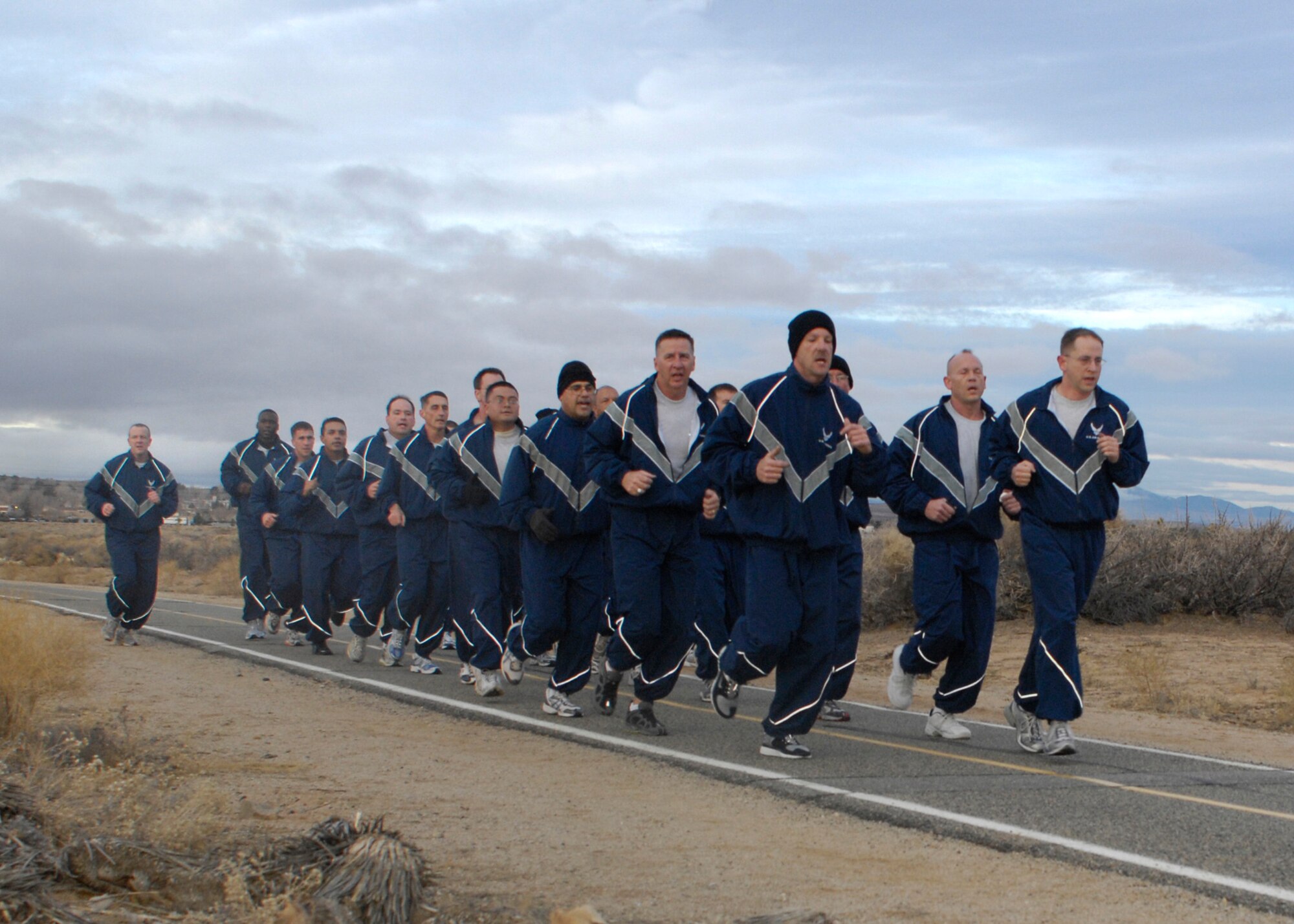 Edwards senior noncommissioned officers run during a group SNCO physical training session at the Rosburg Fitness Center here Dec. 18. Chief Master Sgt. Jonathan Hake, command chief of Air Force Materiel Command, participated in the PT session. (Photo by Jeffrey Youngblood)