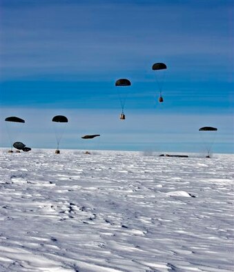 Containerized Delivery System bundles drift to the gound at the South Pole. The bundles were airdropped by a McChord C-17 supporting Operation Deep Freeze. The 13th Air Force-led Operation Deep Freeze is a unique joint and total force mission that has supported the National Science Foundation and U.S. Antarctic Program since 1955. By validating the C-17 capability to complete airdrop missions at the Geographical South Pole, Joint Task Force-Support Forces Antarctica demonstrated its ability to provide mid-winter emergency re-supply and flexible support to the National Science Foundation and U.S. Antarctica Program. (Photo by Forest Grant, IceCube Project) 
