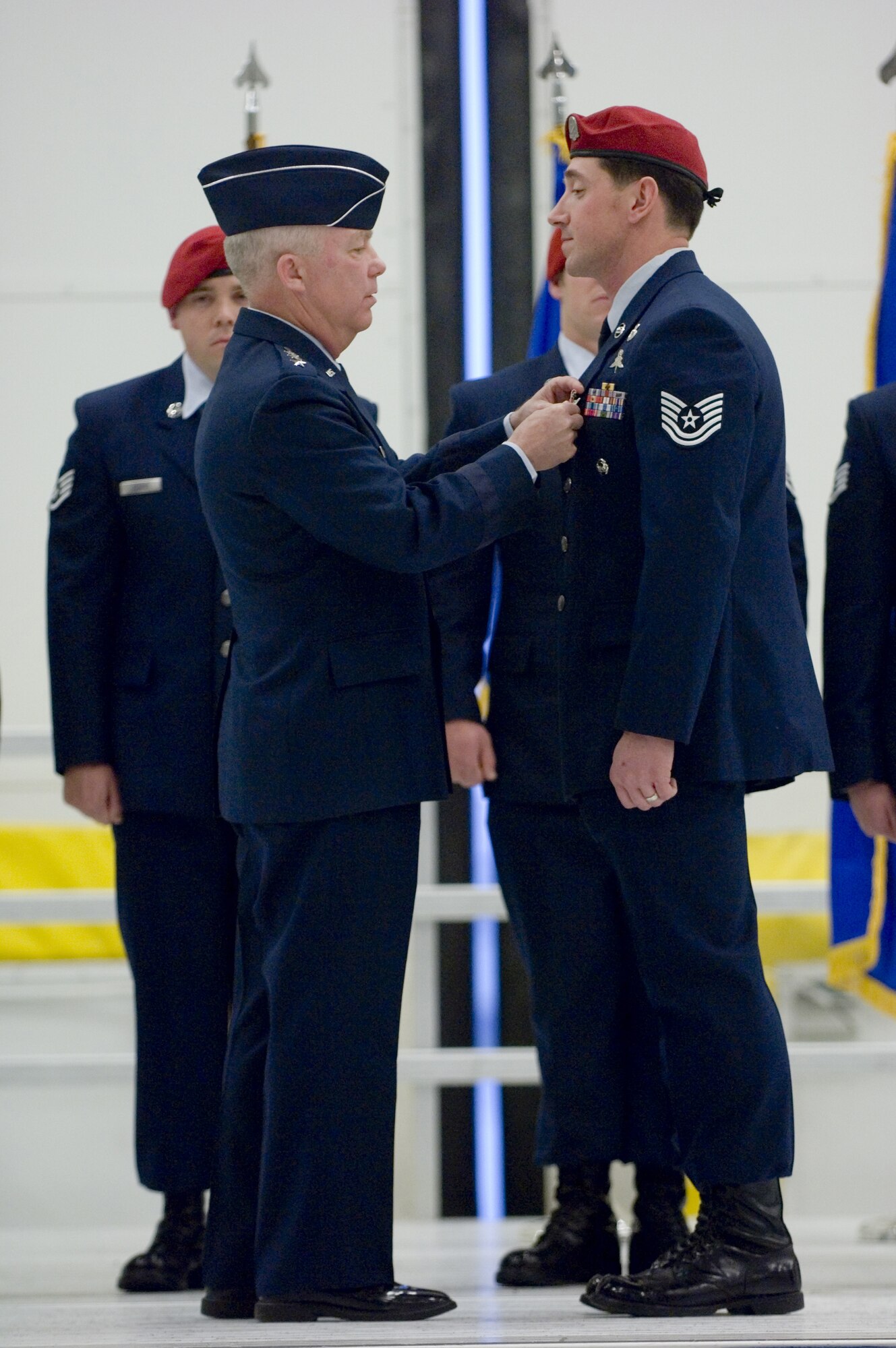 Lt. Gen. Donny Wurster (left), Air Force Special Operations Command commander, presents a Bronze Star with valor to Tech. Sgt. Jason Dryer (right), 22nd Special Tactics Squadron, during a medal ceremony at McChord Air Force Base, Wa., Dec. 18. Sergeant Dryer received the medal for his actions while serving as a joint terminal air controller during a summer 2007 firefight with Taliban forces in Afghanistan. The combat controller also received a Purple Heart and Air Force Combat Action Medal during the ceremony. (U.S. Air Force photo/Abner Guzman)
