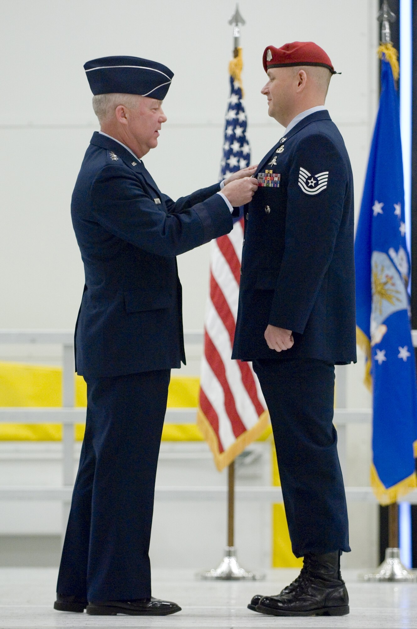 Lt. Gen. Donny Wurster, Air Force Special Operations Command commander, pins the Silver Star on Tech. Sgt. Scott Innis, 22nd Special Tactics Squadron, during a medal ceremony at McChord Air Force Base, Wa., Dec. 18. The Silver Star, the nation's third highest decoration for valor, was presented first to Sergeant Innis for his actions during a firefight with enemy forces in Afghanistan during spring 2006. Sergeant Innis also received a Bronze Star with valor and an Air Force Combat Action Medal for his actions during his unit's 2007 deployment to Southwest Asia. (U.S. Air Force photo/Abner Guzman)