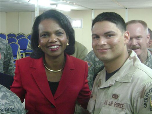 Senior Airman Johnny Luna, a Reservist from San Antonio's 433rd Airlift Wing and currently deployed to the 506th Expeditionary Security Forces Squadron in Iraq, met Secretary of State Condoleezza Rice during her recent visit to Iraq. Airman Luna, while serving a four-month tour, was recognized at the Airman of the Quarter for the 506th ESFS.  (U.S. Air Force Courtesy Photo)                          