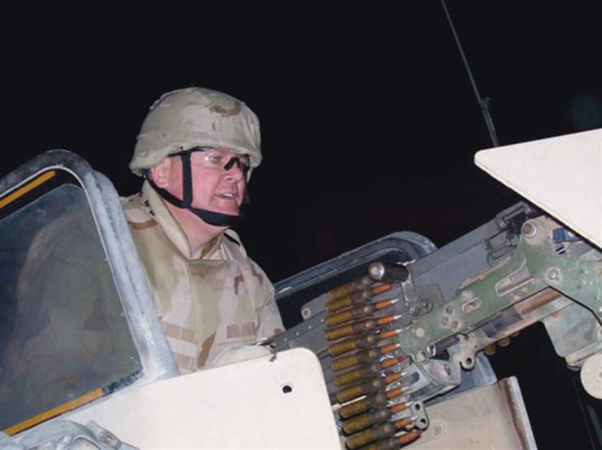 Lt. Col. Joseph Bialke poses with a .50-caliber machine gun during a convoy trip in Iraq. He received a Bronze Star for his efforts in. Colonel Bialke earned the bronze star for humanitarian actions during his deployment to Iraq from March to October 2007. (Courtesy photo)