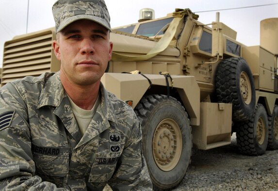 Staff Sgt. Eric Eberhard kneels in front of a joint explosive ordnance disposal rapid response vehicle Dec. 17 at Forward Operating Base Gardez, Afghanistan. Sergeant Eberhard's quick reactions allowed him to save the life of the leader of his three-person EOD team after an improvised explosive device detonated near them Dec. 7. He is a Salt Lake City native deployed from the 419th Civil Engineer Squadron at Hill Air Force Base, Utah. (U.S. Air Force photo/Staff Sgt. Josh Jasper)