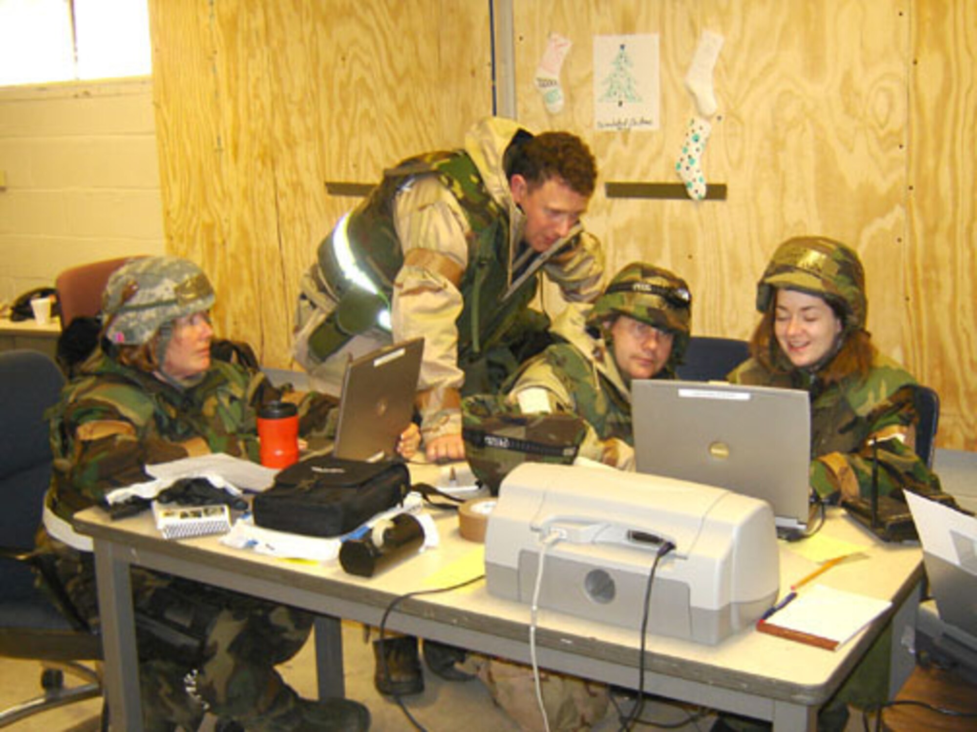 During the recent Operational Readiness Inspection, Public Affairs staff from the 403rd Air Wing (in Dessert uniform) joined with the 433rd Airlift Wing (BDU uniform). The combined team earned high marks for their ability to get the news out quickly and acurately during various threat levels. From left to right are Master Sgt. Collen McGee, Maj. Chad Gibson, Tech. Sgt. Michael Duhe and Capt. Carla Gleason. (U.S. Air Force Courtesy Photo)                              