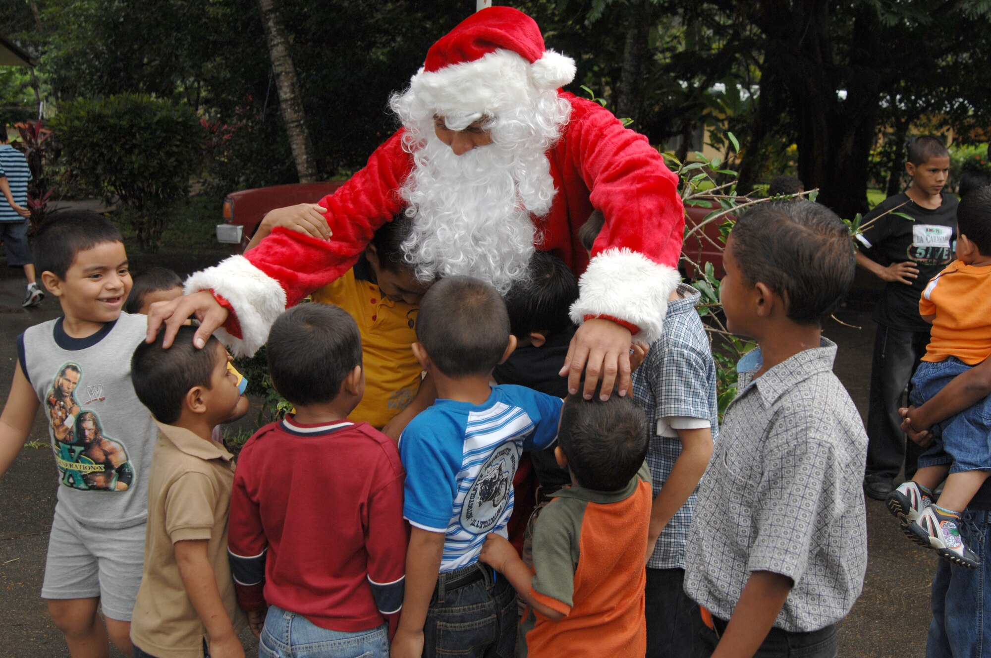 Tech. Sgt. Norman Padilla Cruz, 1st Special Operations Aeromedical Squadron, dresses up like Santa Claus to greet the children at Aldea Infantil S.O.S Orphanage in La Ceiba, Honduras, Dec. 13 as part of Operation Christmas Wish. Operation Christmas Wish is an annual trip made by 1st Special Operations Wing Airmen, delivering more than 9,000lbs of Christmas packages to hundreds of Honduran orphans. (U.S. Air Force photo/Senior Airman Stephanie Jacobs)