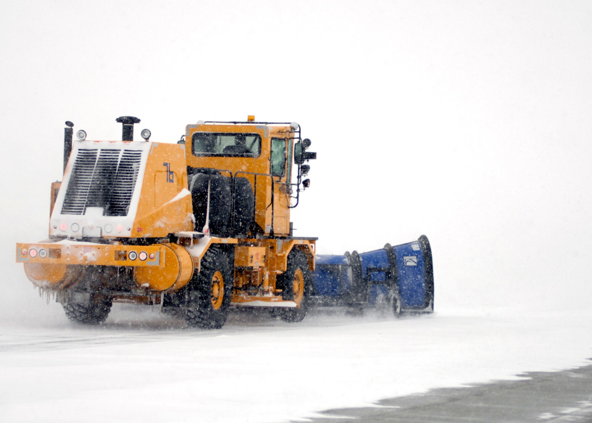 GRAND FORKS AIR FORCE BASE, N.D. ? Heavy equipment operators, affectionately referred to as ?Dirt Boyz? by their fellow civil engineer squadron peers, clear the flightline here Dec. 4 after a snow storm using sweepers, plows and graters (photo/Staff Sgt. J. Paul Croxon).