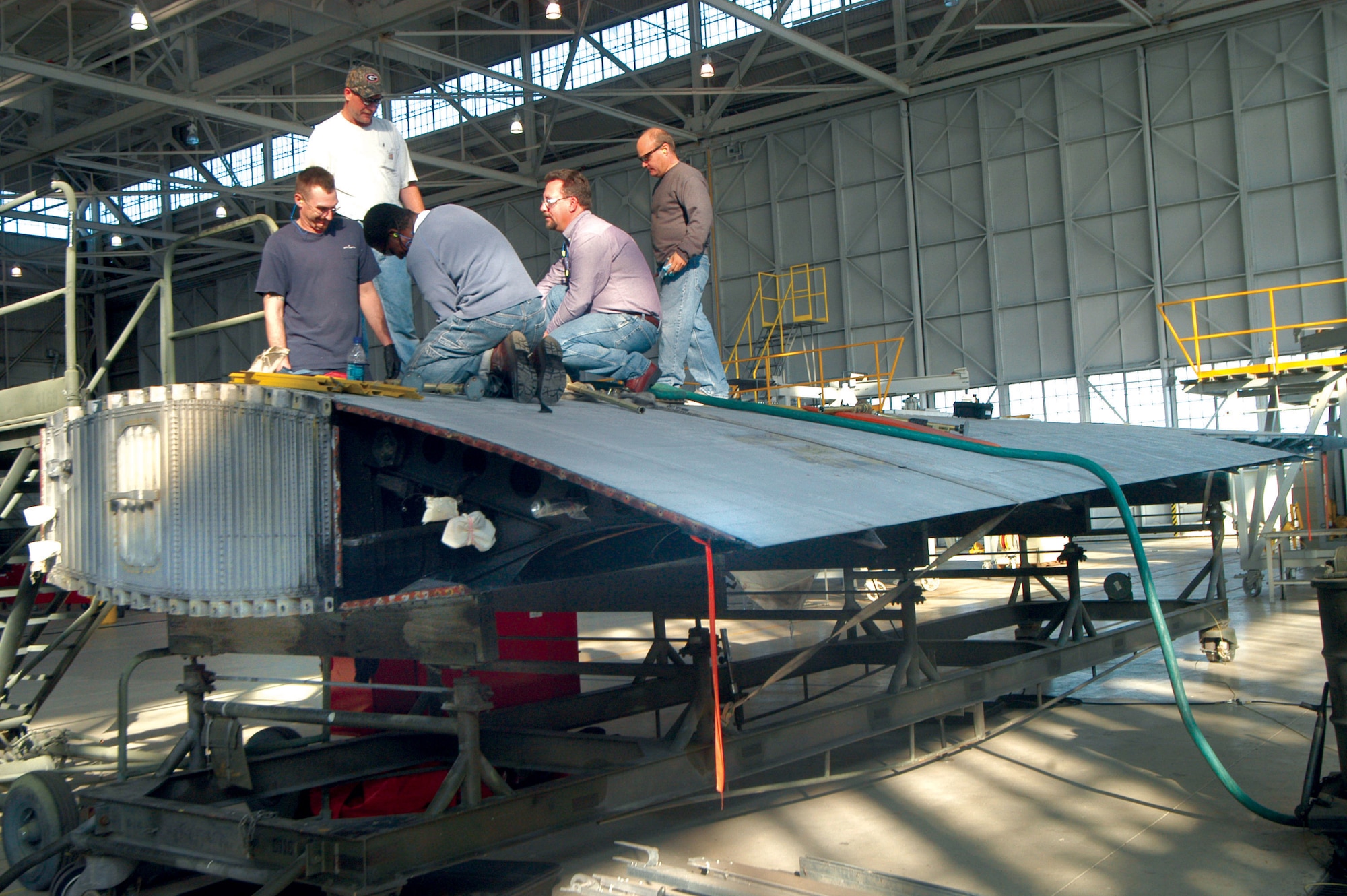 C-130 Hercules workers receive hands-on training from Doug Wall atop the wing during a class at Robins Air Force Base, Ga. Robins AFB units combined forces to procure a wing so students of the 373rd Training Squadron's Field Training Detachment could have hands-on training. (U.S. Air Force photo/Sue Sapp) 
  