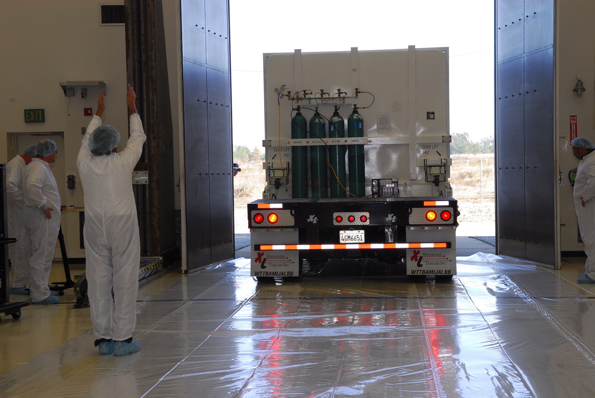 VANDENBERG AIR FORCE BASE, Calif. -- The Defense Meteorological Satellites Program satellite is transported into the "clean room" to be uncovered, here on Dec. 14.The DMSP satellite monitors solar-terrestrial physics and provides photographic reconnaissance and surveillance for the U.S. Department of Defense. It's a valuable tool in scheduling and protecting military operations in the Air Force.
(U.S. Air Force photo/Airman 1st Class Ashley Tyler)
