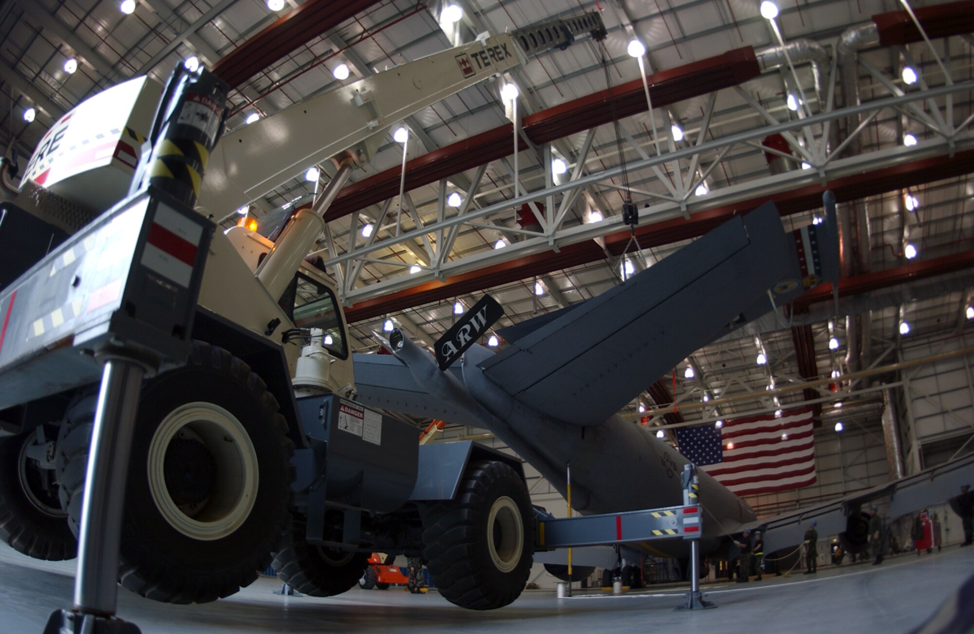 Master Sgt. Barrett Hatch, 100th Aircraft Maintenance Squadron, uses a crane to lower a vertical stabilizer into place Dec. 18. About a dozen Airmen with the 100th Maintenance Group helped remove and replace a vertical stabilizer on a KC-135 Stratotanker here Dec. 16. During a routine isochronal inspection, the vertical stabilizer was found to be corroded, warranting repairs. (U.S. Air Force photo by Senior Airman Clark Staehle)                                   