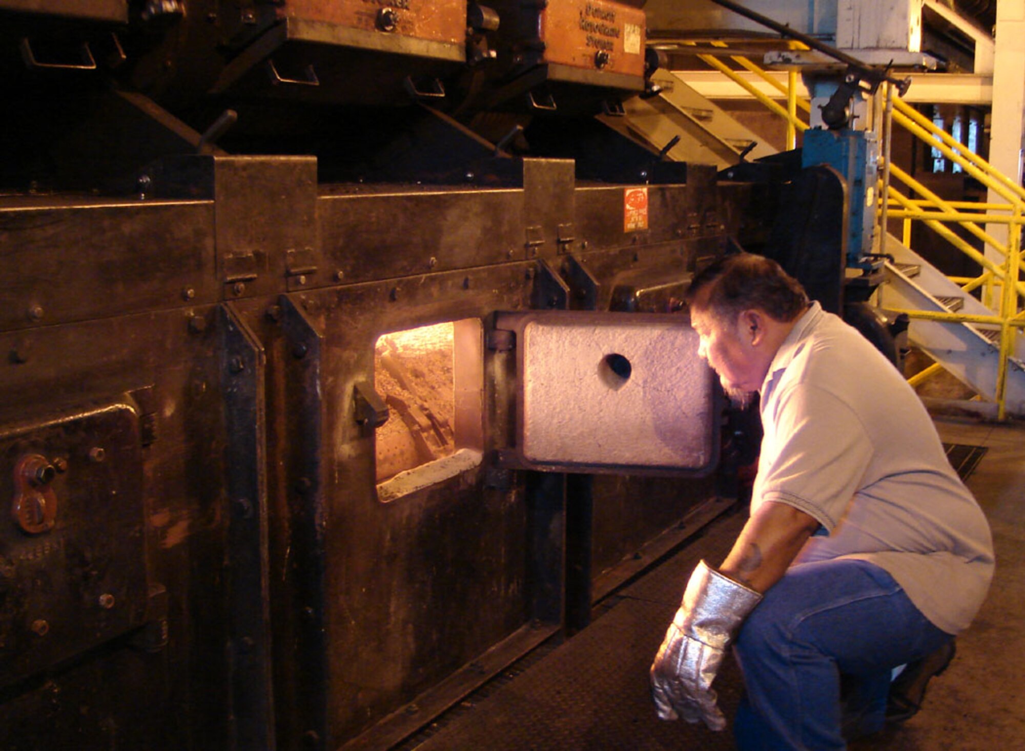 Luis Charfarous, a 30-year civil servant, checks one of the boilers at the Malmstrom Heat Plant. Mr. Charfarous is one of several heat plant shift workers who will work a portion of Christmas Day to ensure Team Malmstrom members stay warm. (U.S. Air Force photo/Valerie Mullett)