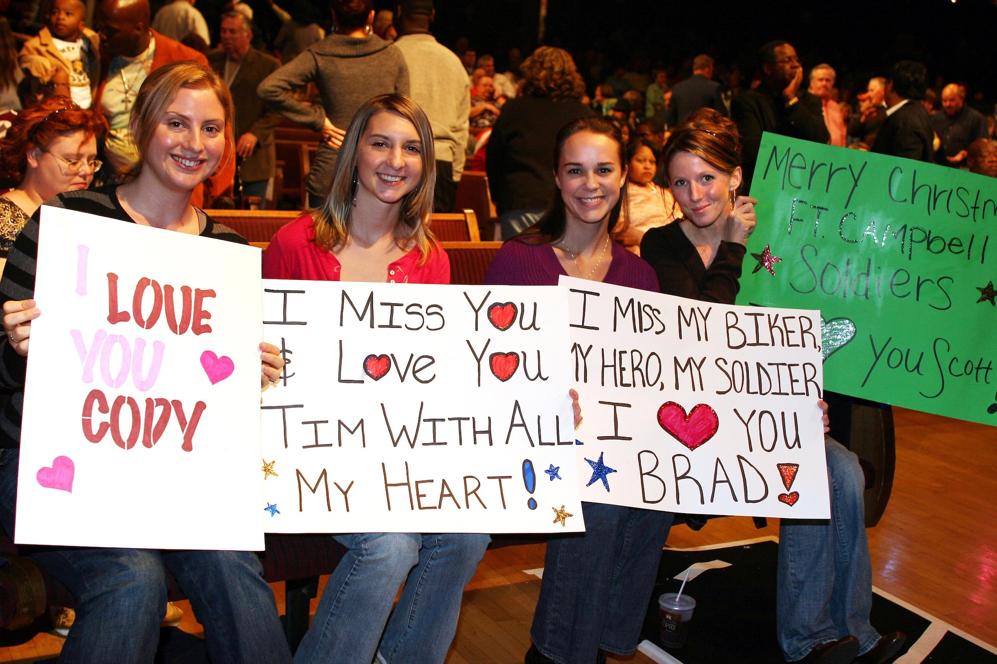 Audience members send their holiday wishes to deployed loved ones at this year's Holiday Notes from Home at the Grand Ole Opry in Nashville, Tenn.  Holiday Notes from Home is a free annual concert recorded for broadcasting to audiences around the world during December (U.S. Air Force photo).