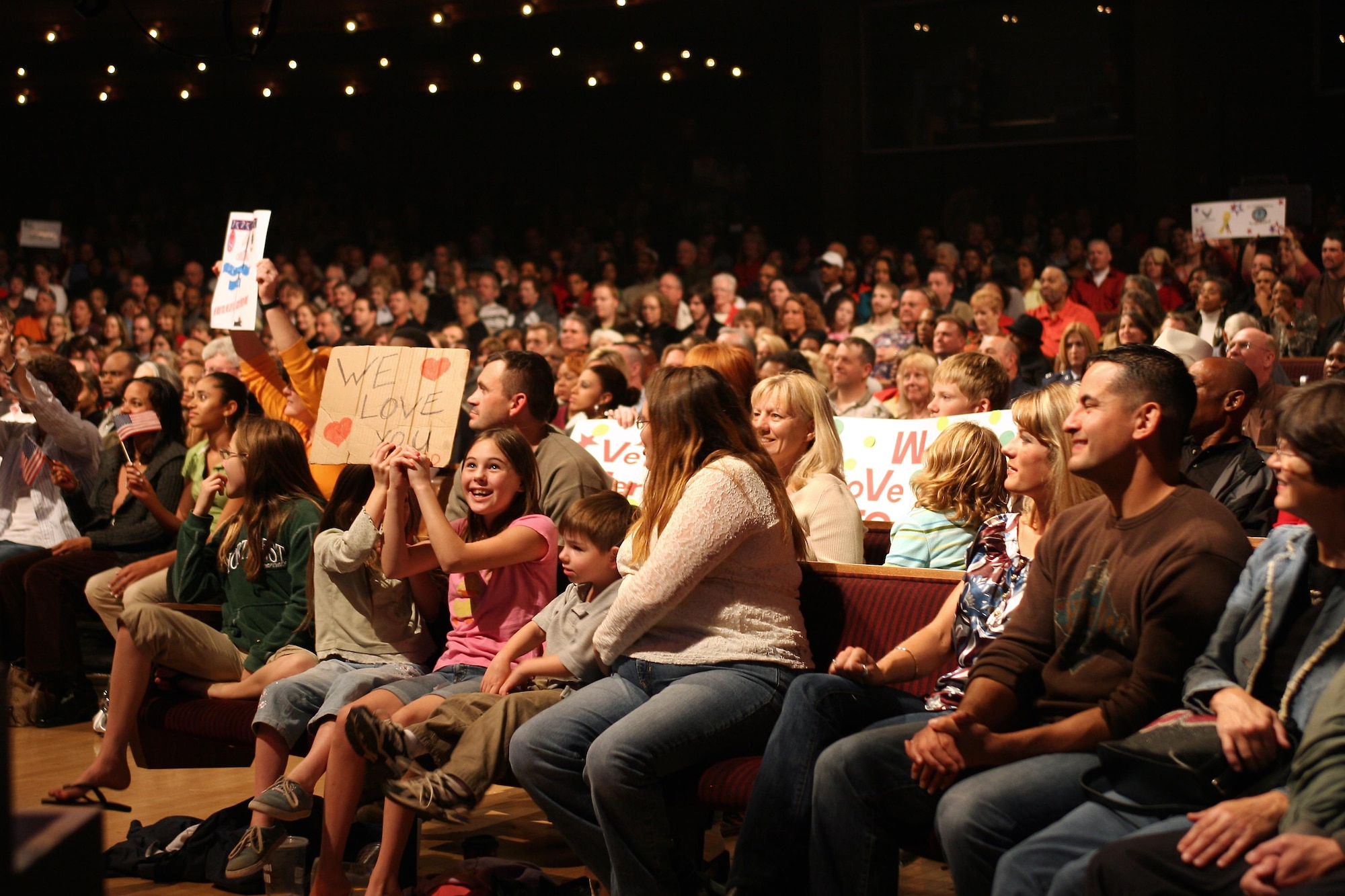 Audience members at this year's Holiday Notes from Home at the Grand Ole Opry in Nashville, Tenn.  Holiday Notes from Home is an annual concert recorded for broadcasting to audiences around the world during December. The Band of the Air Force Reserve and the Air Force Strings performed in the show.(U.S. Air Force photo)