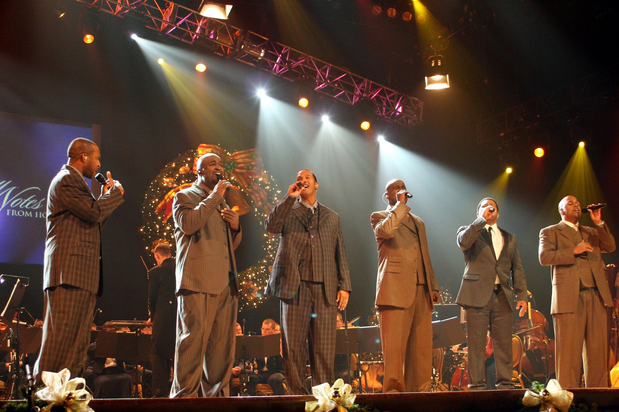 Take 6 performs at this year's Holiday Notes from Home at the Grand Ole Opry in Nashville, Tenn.  Holiday Notes from Home is an annual concert recorded for broadcasting to audiences around the world during December. The band of the Air Force Reserve and the Air Force Strings performed in the show. (U.S. Air Force photo)