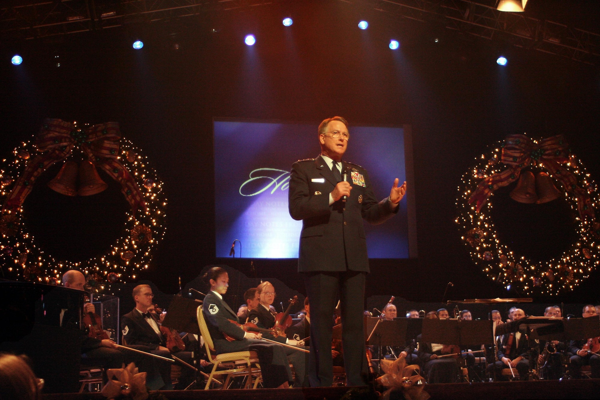 Lt. Gen. John A. Bradley, chief of the Air Force Reserve, addresses the audience at this year's Holiday Notes from Home recording session at the Grand Ole Opry in Nashville, Tenn.  Holiday Notes from Home is an annual concert recorded for broadcasting to audiences around the world during December. The band of the Air Force Reserve and the Air Force Strings performed in the show. (U.S. Air Force photo).