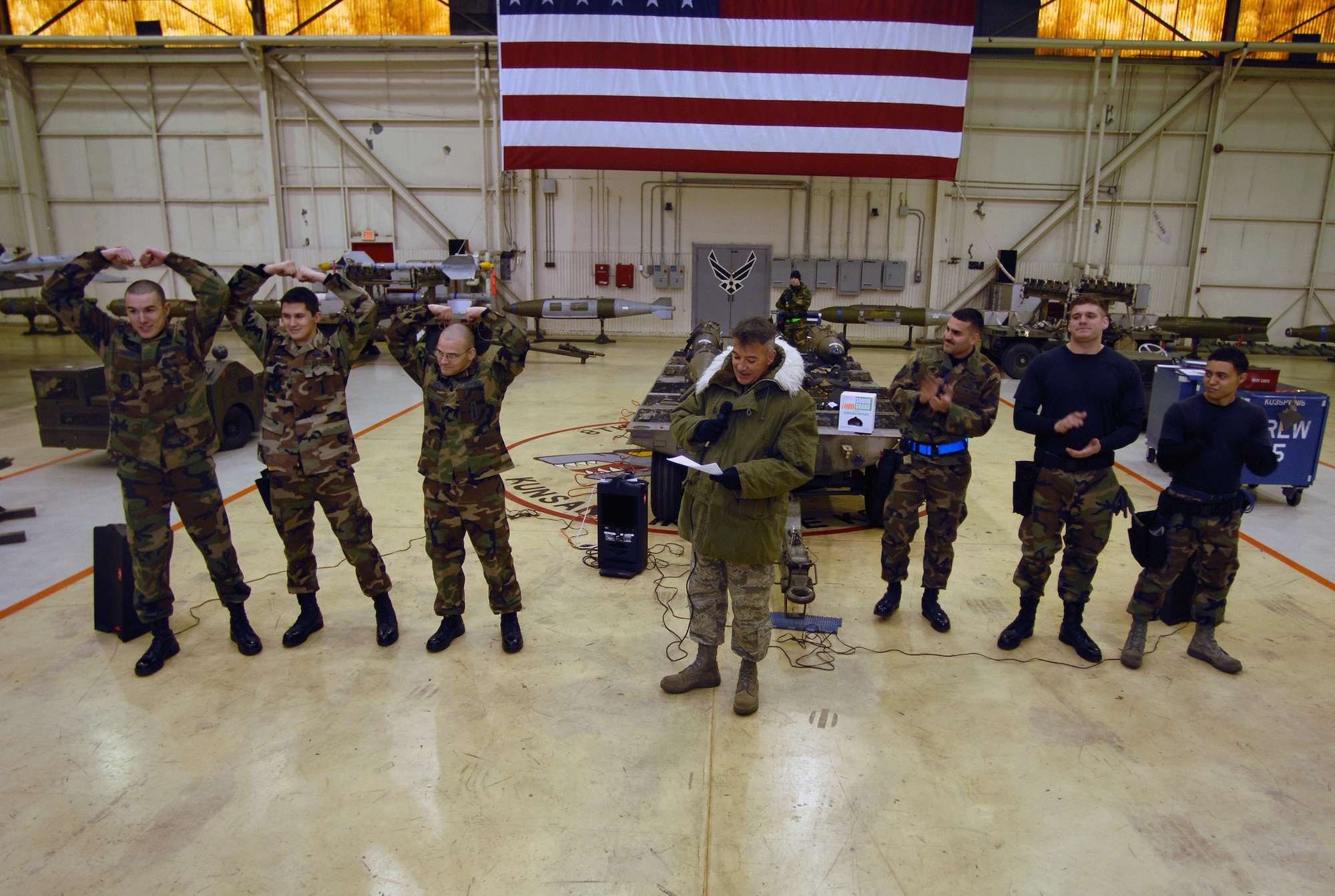 Chief Master Sgt. William McElligott pronounces the 80th Fighter Squadron winner's of the weapons load competition Dec. 14 at Kunsan Air Base, South Korea. This was the final weapon's load competition between the 80th and the 35th Fighter squadrons for 2007. Chief McElligott is the 8th Fighter Wing weapons manager. (U.S. Air Force photo/Senior Airman Steven R. Doty)

