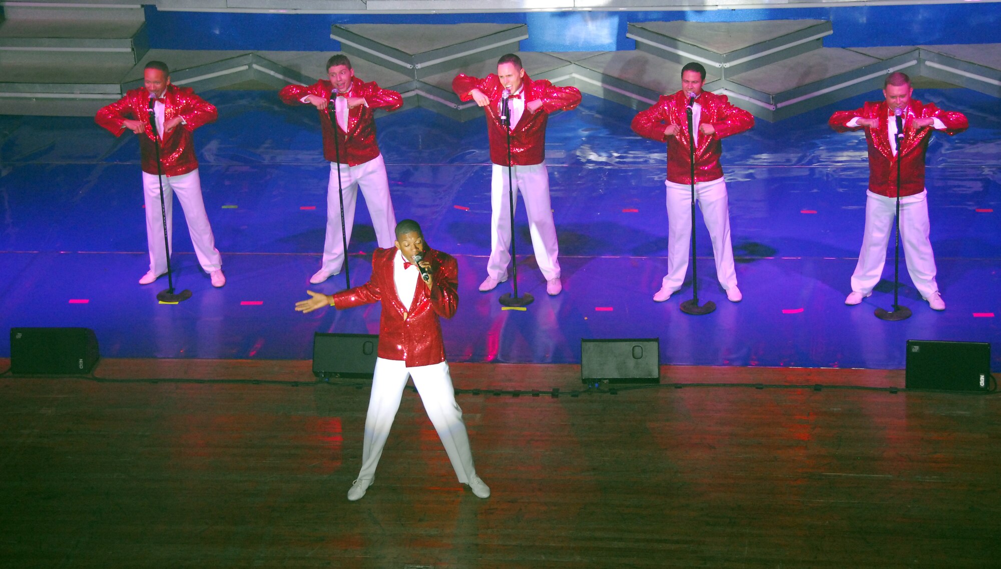 OSAN AIR BASE, Republic of Korea --  Members of U. S. Air Force Tops in Blue perform a rendition of the Temptations during a visit to the   ROKAF Air Force Academy during Tops in Blue's annual world tour celebrating "The Fly-By", a musical tribute to 60 years of proud Air Force history. (U. S. Air Force photo by Staff Sgt Ronnie Hill)  