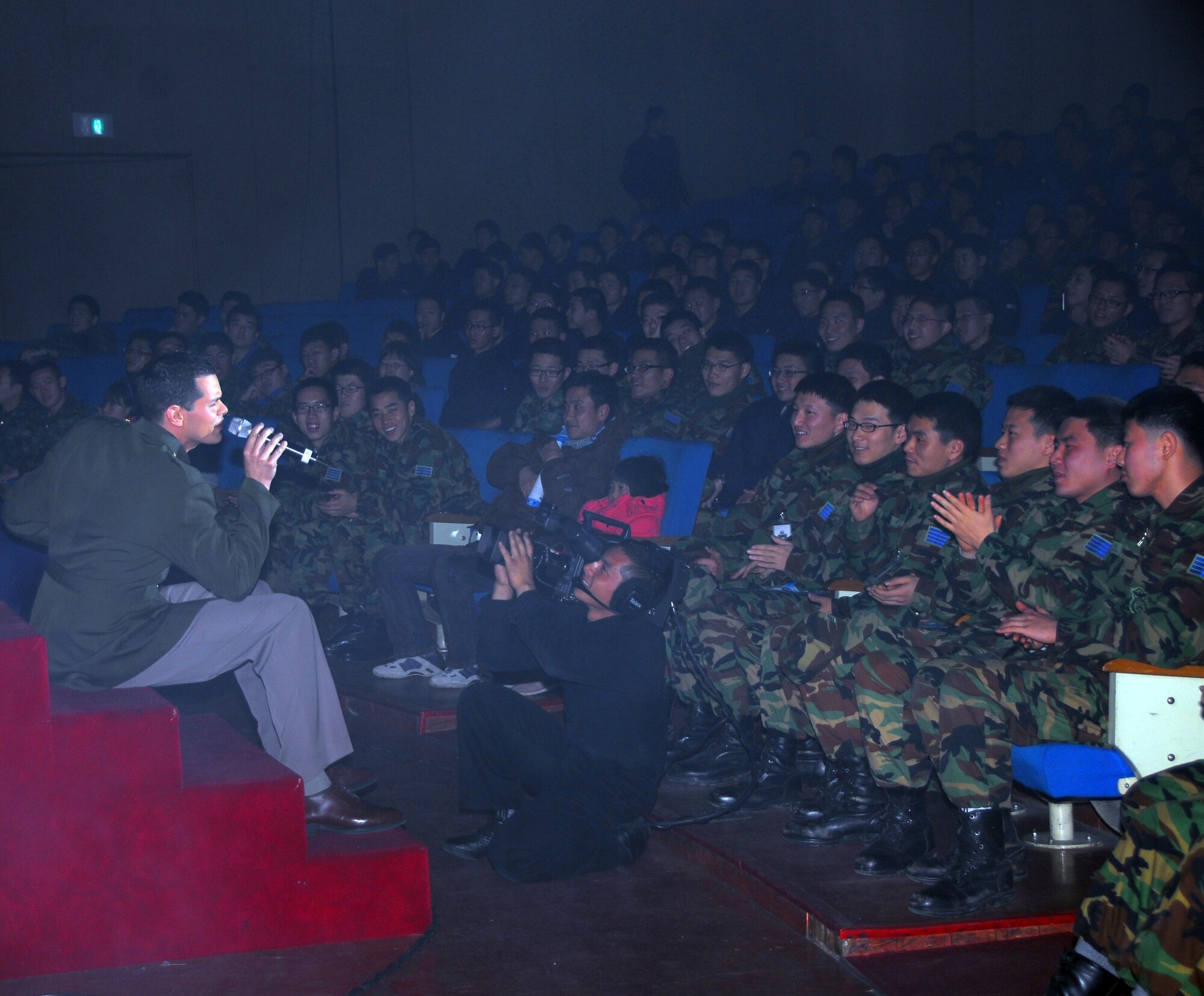 OSAN AIR BASE, Republic of Korea -- U. S. Air Force Tops in Blue vocalist, Staff Sgt. Daniel Rutherford performs for members of the ROKAF Air Force Academy during Tops in Blue's annual world tour celebrating "The Fly-By", a musical tribute to 60 years of proud Air Force history. (U. S. Air Force photo by Staff Sgt Ronnie Hill)  