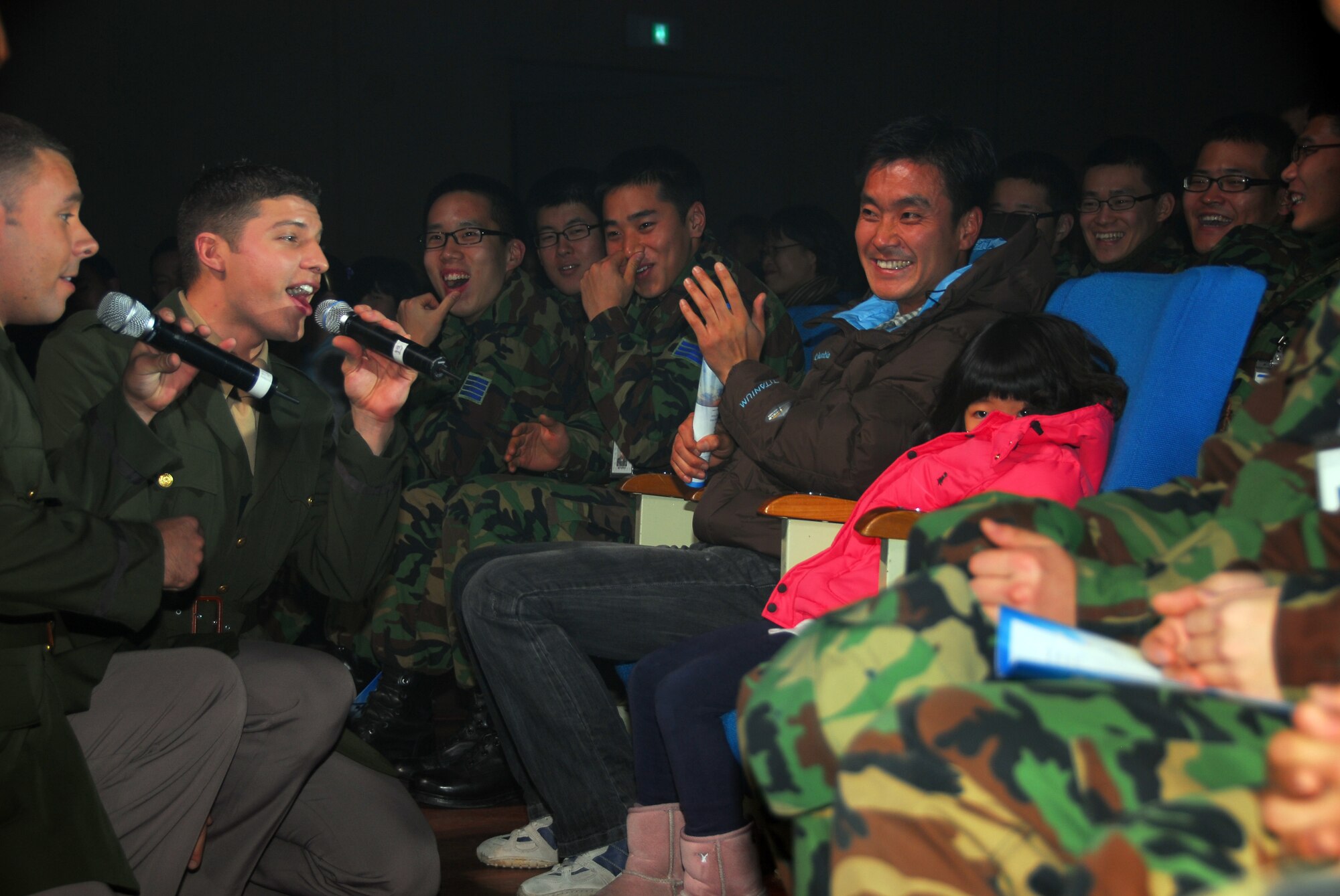 OSAN AIR BASE, Republic of Korea -- (L to R) U. S. Air Force Tops in Blue vocalist, Senior Airmen Nicholas Amari and Jonathan Hayden perform for members of the ROKAF Air Force Academy during Tops in Blue's annual world tour celebrating "The Fly-By", a musical tribute to 60 years of proud Air Force history. (U. S. Air Force photo by Staff Sgt Ronnie Hill)  