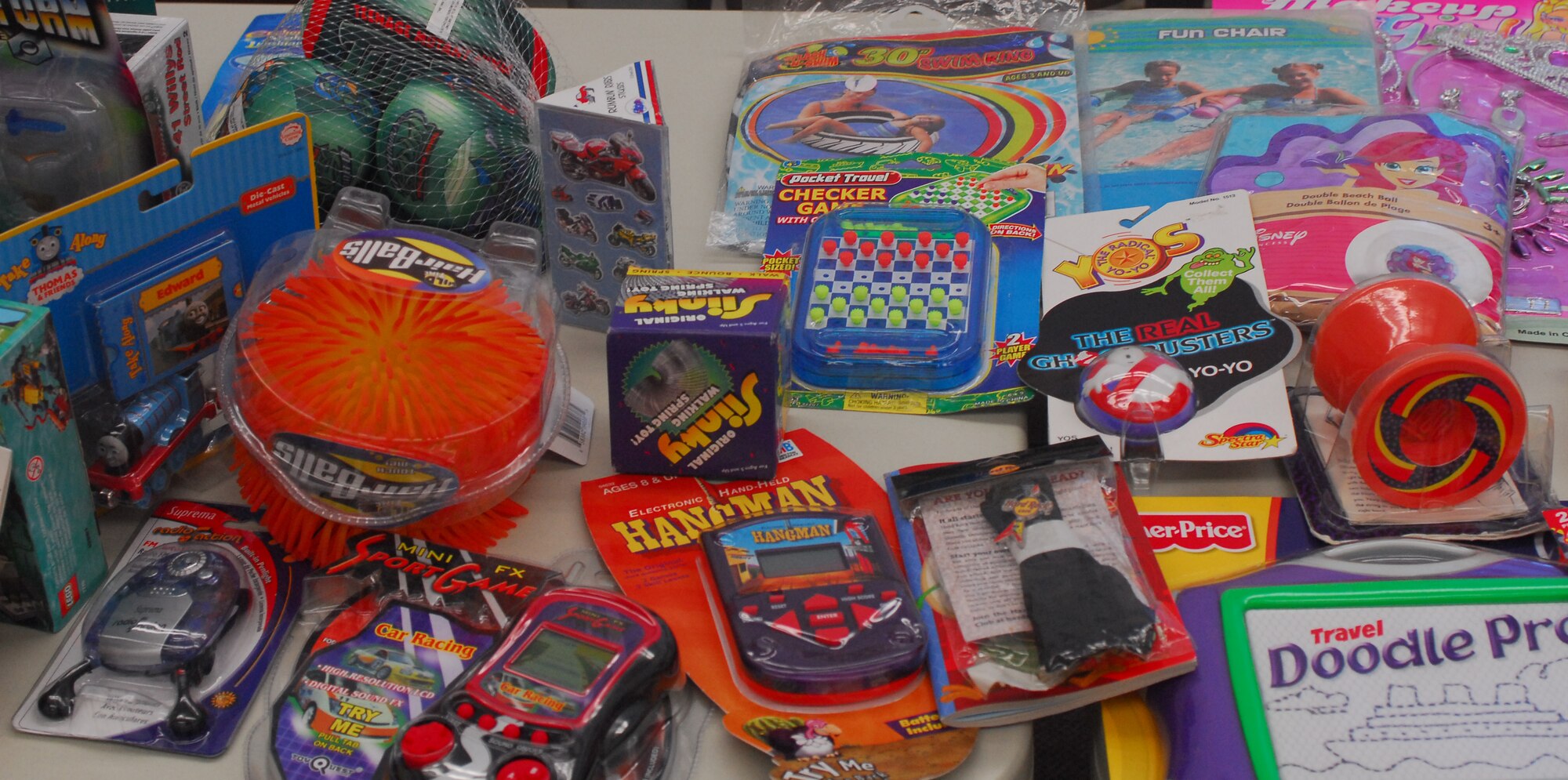 Small toys are displayed on a shelf in the Toy Store in classroom one of the Airman and Family Readiness Center. Toys For The Troops' Kids donated toys to the Airman and Family Readiness Center to be handed out to families of deployed Airmen. Each child will be able to choose 2 toys, one large and one small toy or two small toys. Photo by Staff Sgt. Erin Smith