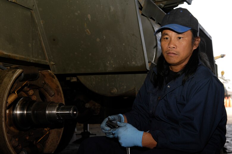 VANDENBERG AIR FORCE BASE, Calif. -- Rudy DeVera, an auto mechanic with the 30th Logistics Readiness Squadron, performs routine maintenance on a vehicle on Dec. 6. 30th LRS combines planning, supply and transportation skills into one organization with all resources to keep pace with the swift demands of deployment. (U.S. Air Force photo/Airman 1st Class Christian Thomas)