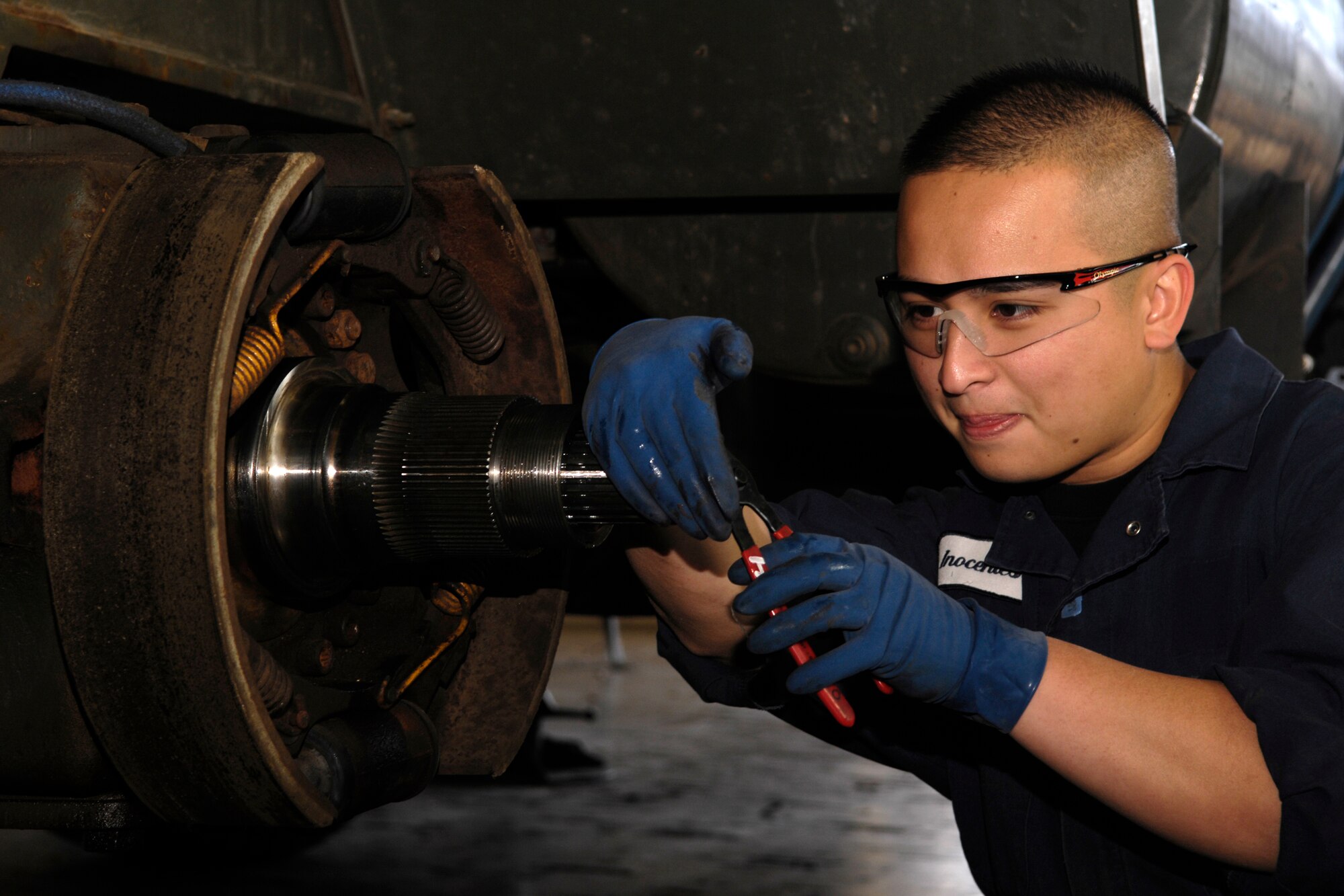 VANDENBERG AIR FORCE BASE, Calif. -- Senior Airman Dennis Inocentes, an auto mechanic with the 30th Logistics Readiness Squadron, performs routine maintenance on a vehicle on Dec. 6. 30th LRS combines planning, supply and transportation skills into one organization with all resources to keep pace with the swift demands of deployment. (U.S. Air Force photo/Airman 1st Class Christian Thomas)