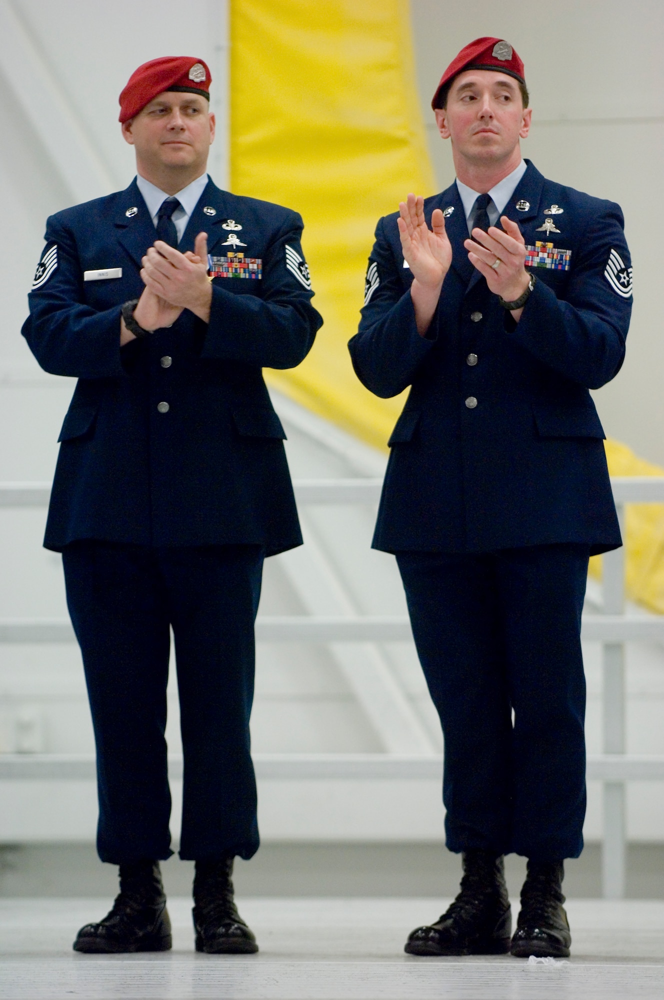 Tech. Sgt. Scott Innis and Tech. Sgt. Jason Dryer, both 22nd
Special Tactics Squadron, applaud during the awards ceremony
Tuesday in which they were both decorated for their actions
in combat.