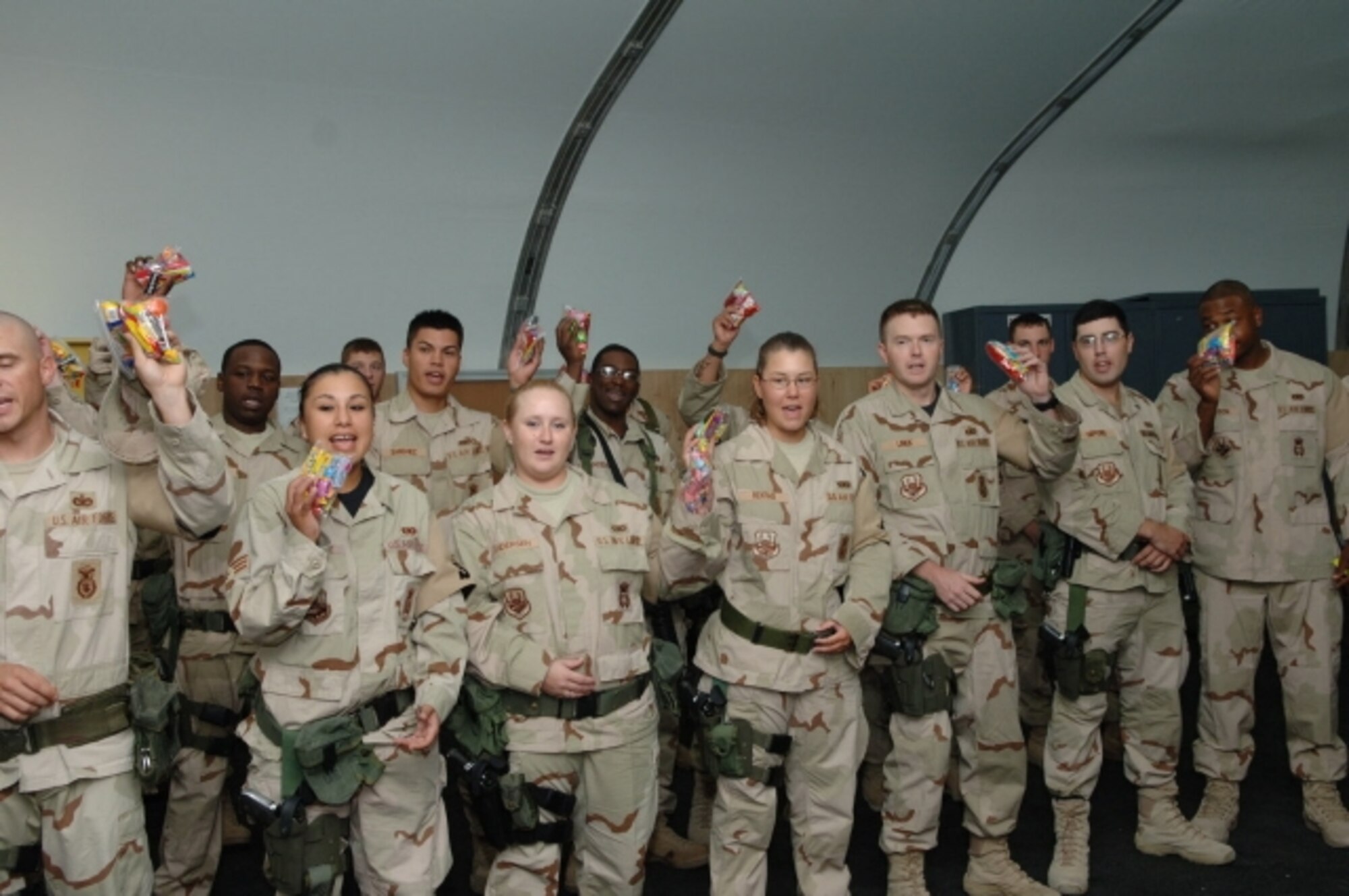 Capt. Fred Testa, 376th Expeditionary Security Forces Squadron, hands out candy at the Nizhanchuisk Orphanage, Gargarin, Kyrgyzstan. The candy was collected at Travis as part of Operation Candy Drop. (U.S. Air Force photo)