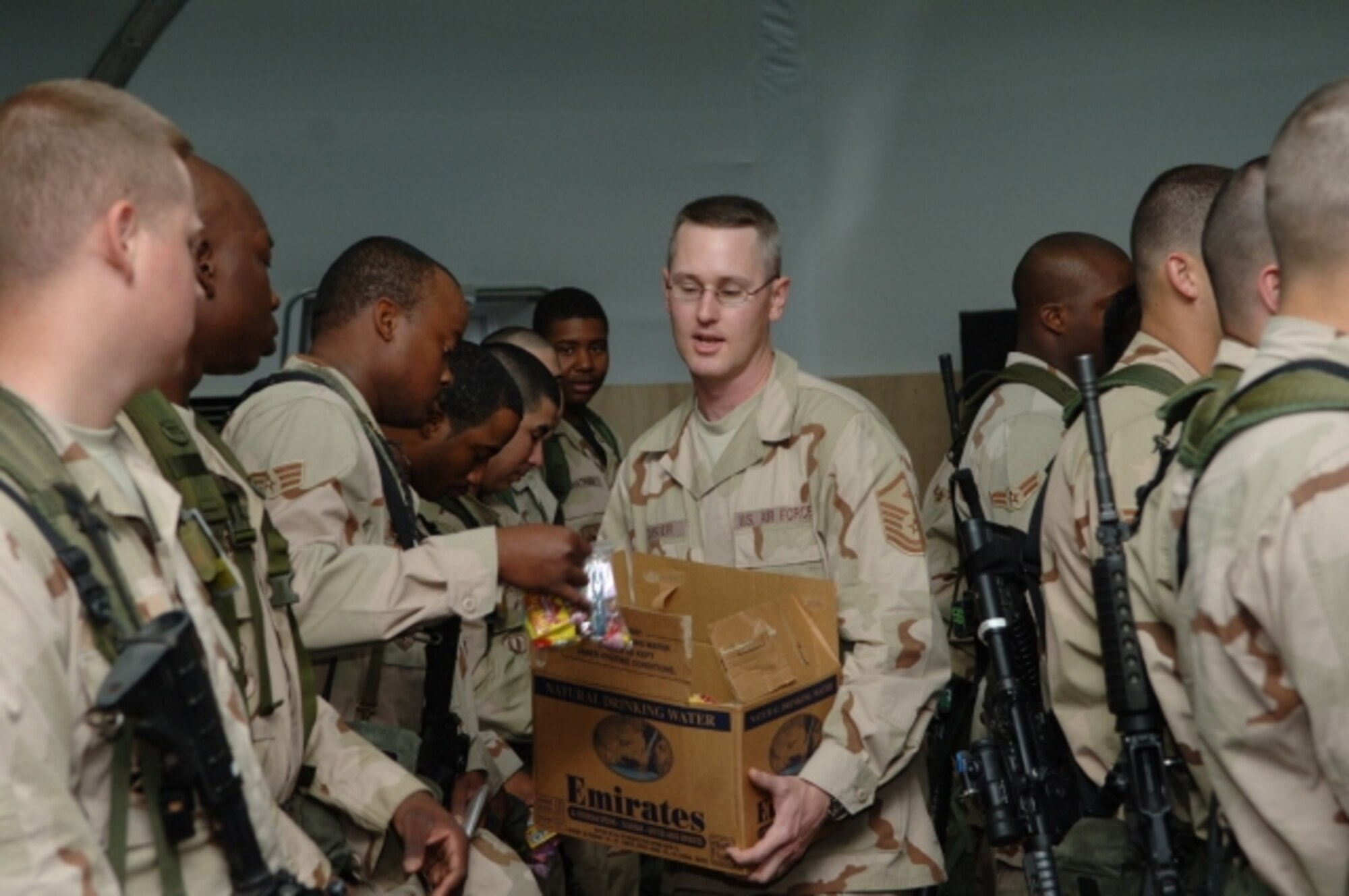 Capt. Fred Testa, 376th Expeditionary Security Forces Squadron, hands out candy at the Nizhanchuisk Orphanage, Gargarin, Kyrgyzstan. The candy was collected at Travis as part of Operation Candy Drop. (U.S. Air Force photo)