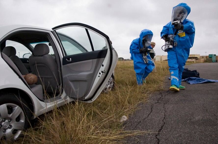 Senior Airman Stephanie Lewis and Senior Airman Patrick Bellamy, Nellis AFB, Nev., members of the Air Combat Command Chemical, Biological, Radiological and Nuclear Challenge team, check a simulated vehicle bomb for possible radiological and chemical contamination during the 2007 Air Force CBRN Challenge held at Brooks City-Base, TX. (U.S. Air Force photo/Steve Thurow)