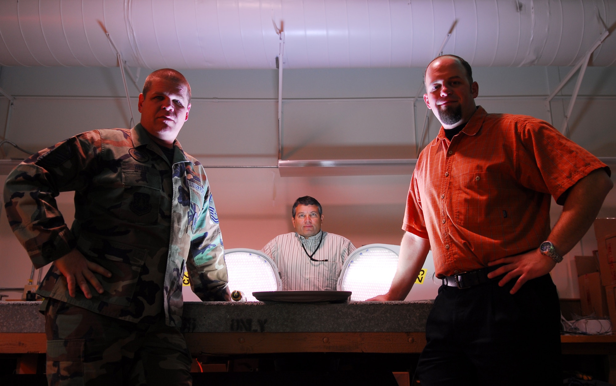 VANDENBERG AIR FORCE BASE, Calif.
Master Sgt. Russ Wells, Scott Bly and Brad King of 30 Civil Engineering Squadron pose by Light Emitting Diode lights during the testing of several lights on Oct. 23. The test was conducted to determine which street light works better to save millions of dollars in energy cost base wide.  (U.S. Air Force photo/Airman 1st Class Ashley Tyler)