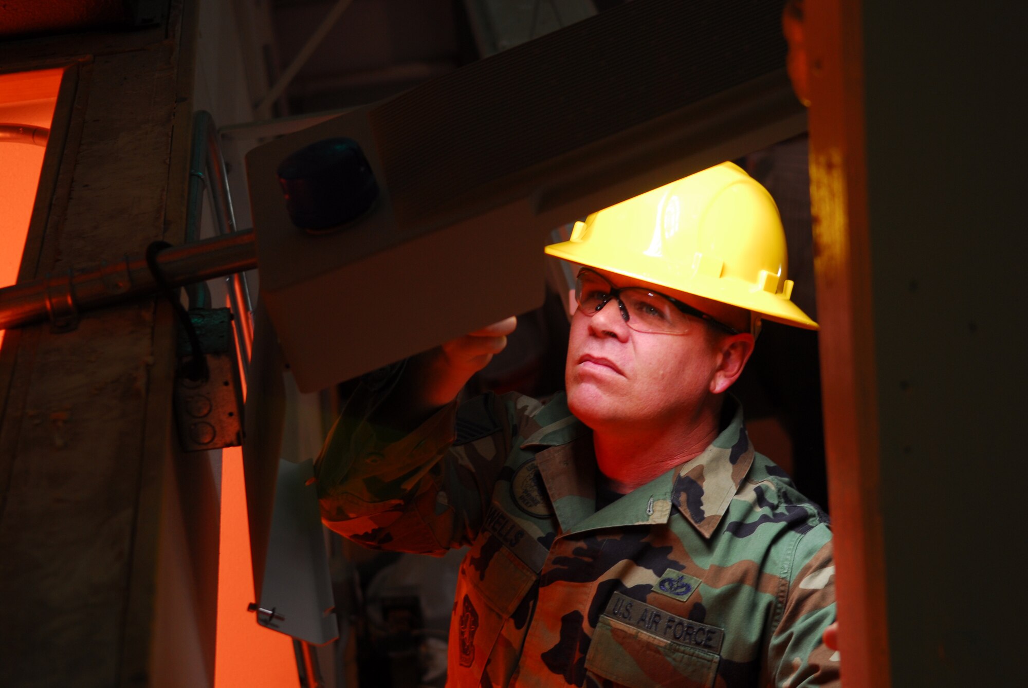 VANDENBERG AIR FORCE BASE, Calif. -- Master Sgt. Russ Wells of 30 Civil Engineering Squadron performs electrical testing on a Light Emitting Diode lights during the testing of several lights on Oct. 23. The test was conducted to determine which street light works better to save millions of dollars in energy cost base wide.  (U.S. Air Force photo/Airman 1st Class Ashley Tyler)