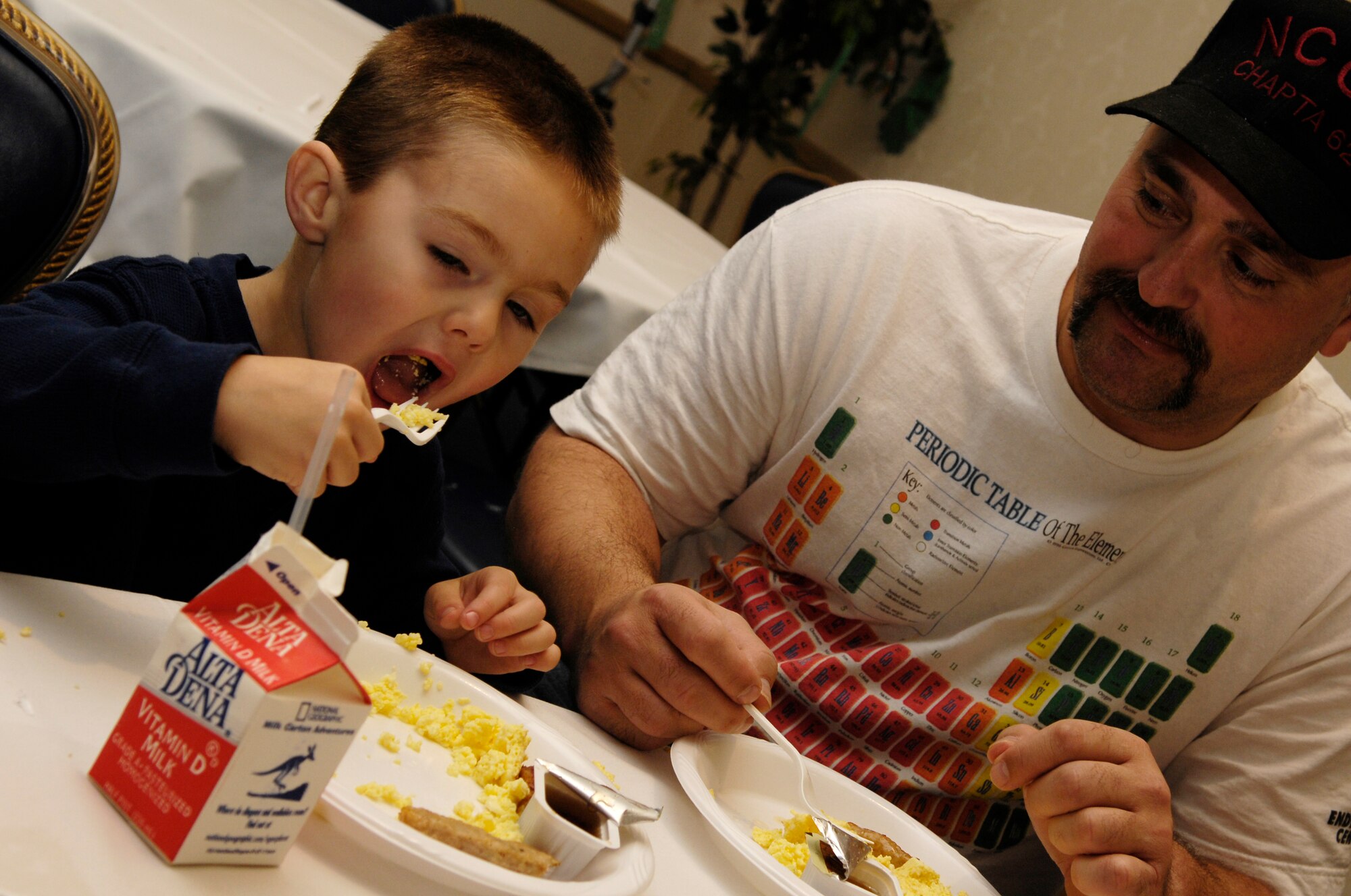 VANDENBERG AIR FORCE BASE, Calif. -- Danny Messman, 3, enjoys a warm morning meal during Breakfast with Santa at the Pacific Coast Club on Dec. 15. Over 500 children attended the annual event hosted by the 30th Services Division. The event was free to the entire base and included a photo opportunity with Santa, breakfast, holiday arts and crafts, games, and prize give-a-ways.  (U.S. Air Force photo/Airman 1st Class Christian Thomas)