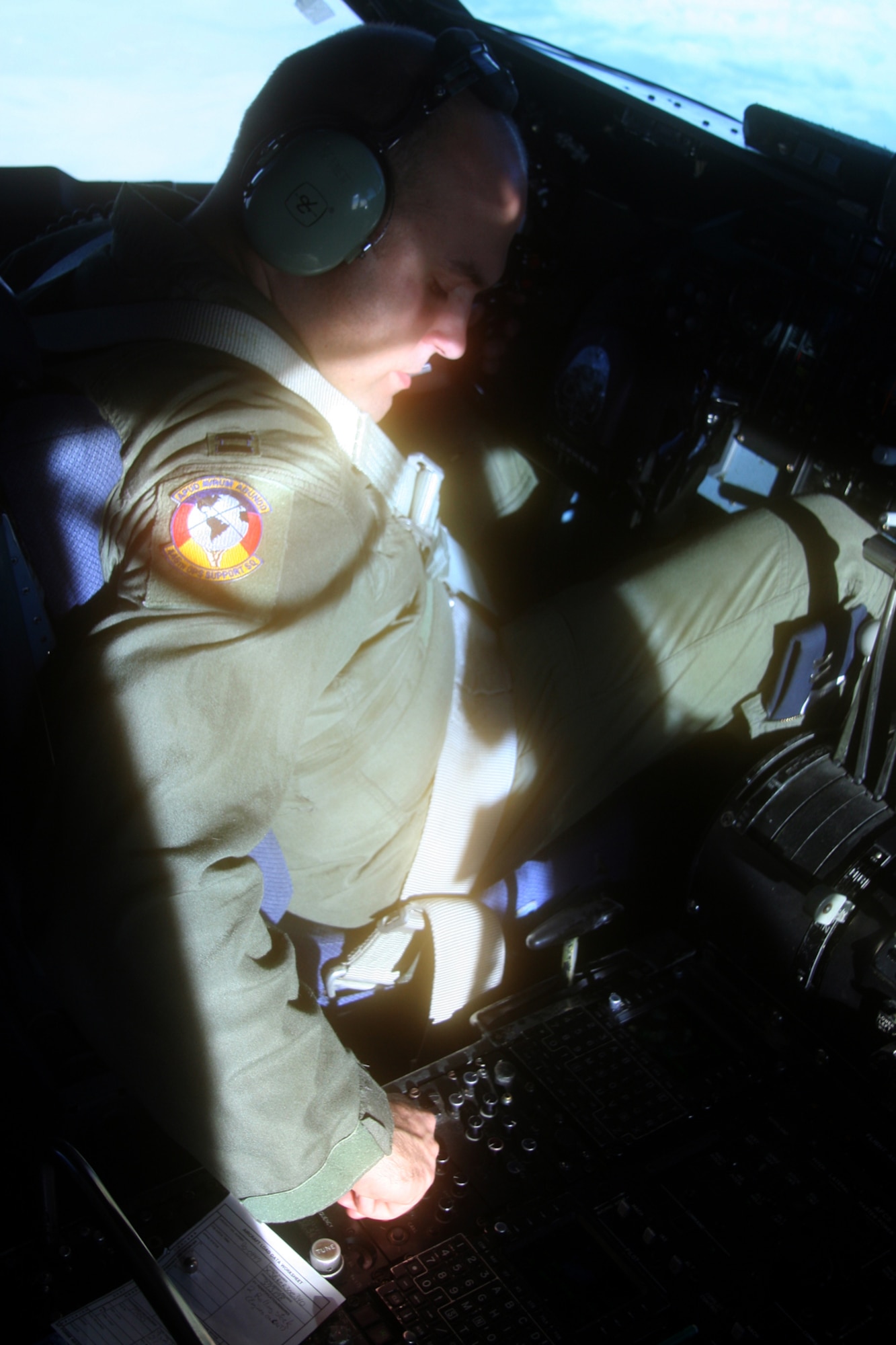 OVER THE ATLANTIC OCEAN -- Pilot Capt. Michael Bennett checks the interments as he flies a C-5 aircraft heading for Dover AFB, Del. (U.S. Air Force photo/Maj. Ted Theopolos)