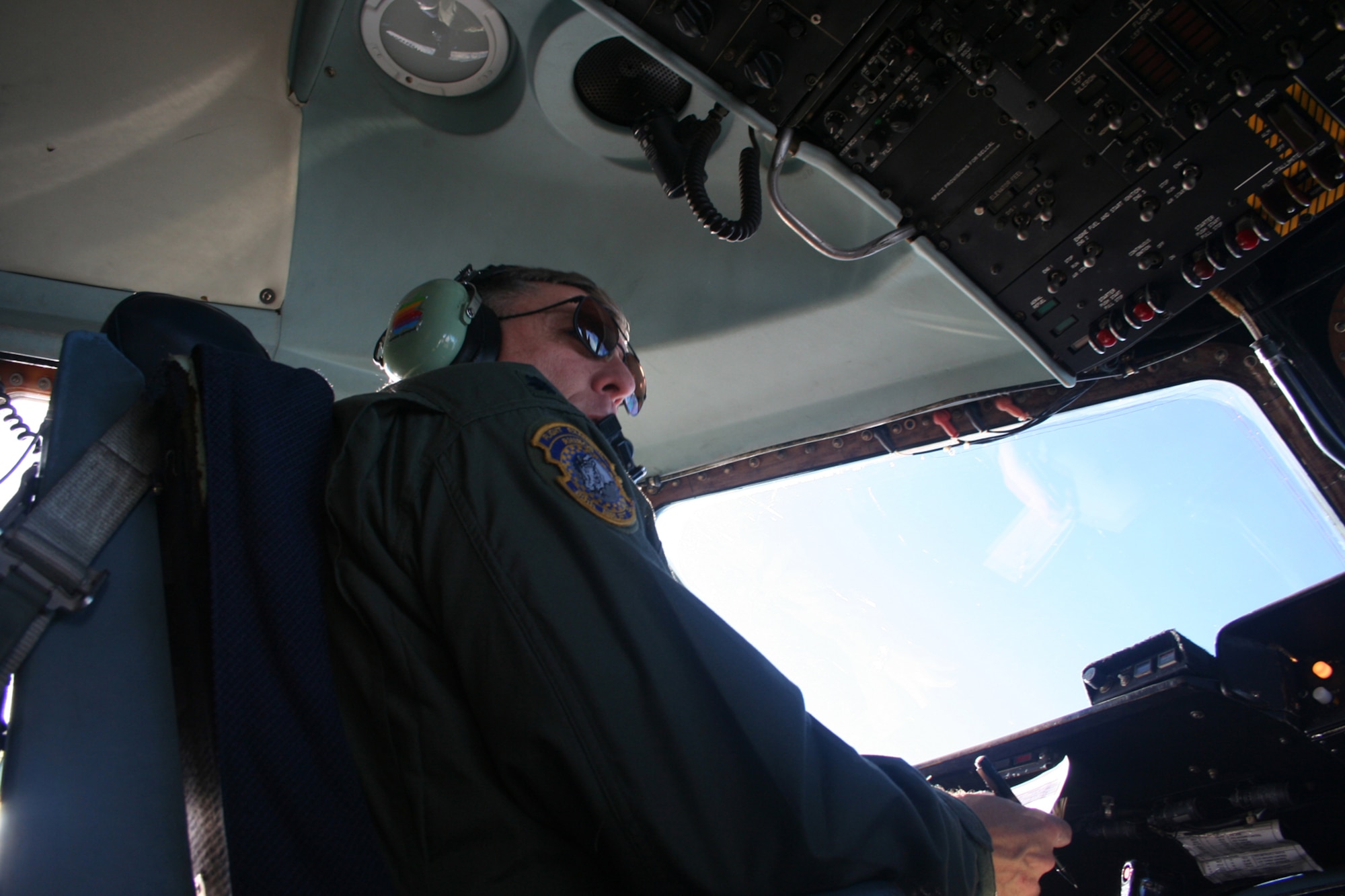 OVER THE ATLANTIC OCEAN -- Pilot Lt. Col. Philip Pierce scans the sky for other aircraft as he flies a C-5. (U.S. Air Force photo/Maj. Ted Theopolos)