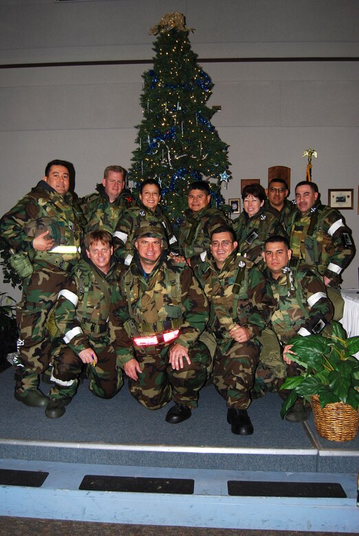 Members of the 433rd Medical Group took time during a recent Operational Readiness to gather for a holiday greeting much like the hometown news holiday greeting program for actual deployed Airmen. Though the deployment is an excercise, the holiday good wishes from the medical group were sincere.  (U.S. Air Force Photo/Master Sgt. Collen McGee)