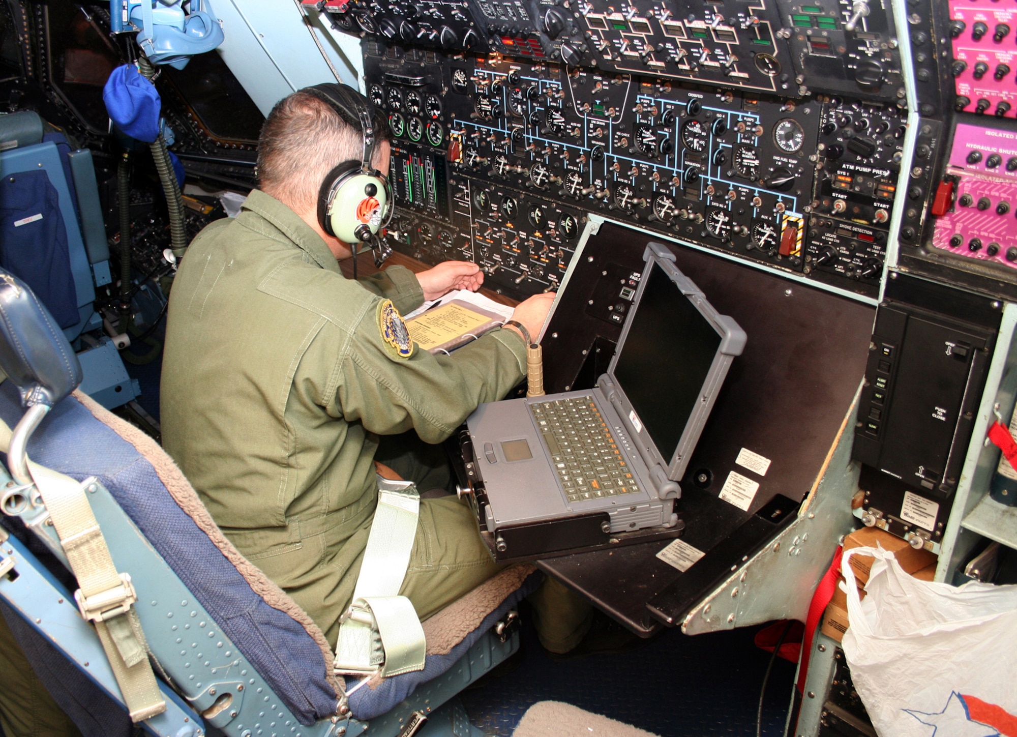 DOVER AIR FORCE BASE, Del -- Flight Engineer Master Sgt. Jon Winters goes through his checklist at the flight engineer’s panel aboard a C-5 aircraft. (U.S. Air Force photo/Maj. Ted Theopolos)