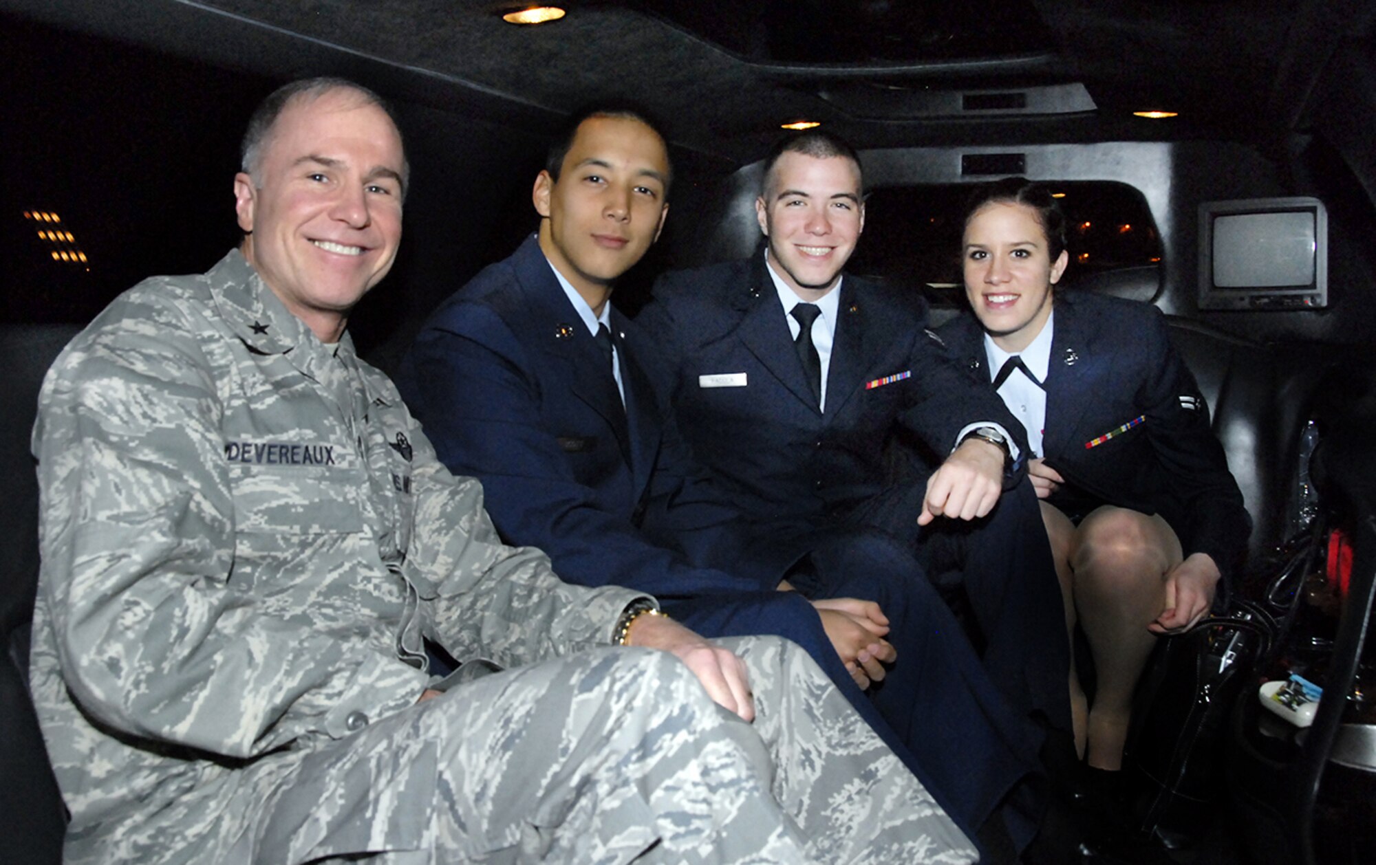 Brig. Gen. Richard Devereaux, 82nd Training Wing commander, spends a few minutes with Airmen in Training before they depart Sheppard by  limousine to begin the annual holiday exodus. Seated, from left to right, include General Devereaux, Airman Jerry Scott, 361st Training Squadron, Airman 1st Class Daryl Padula, 362nd TRS, and Airman 1st Class Emily Pelletier, 362nd TRS. (U.S. Air Force photo/Sandy Wassenmiller)