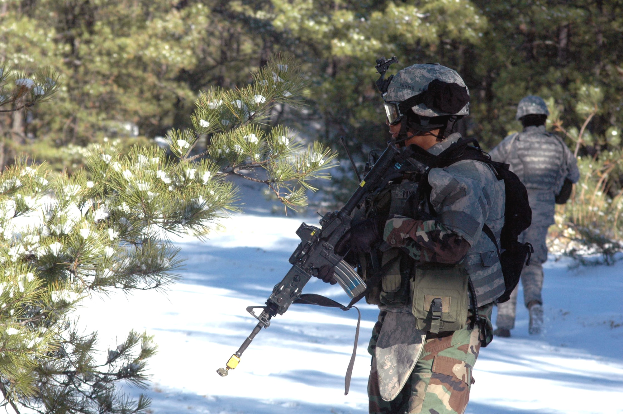 Students in the Tactical Security Element Training Course 08-A practice a dismounted patrol during training on a range on Fort Dix, N.J., Dec. 6.  The course was the first of its kind by the U.S. Air Force Expeditionary Center, also from Fort Dix.  Taught with instructors from the Air Force Office of Special Investigations and security forces cadre from the Center's 421st Combat Training Squadron, the training is designed to prepare security forces for "outside the wire" missions with OSI in the deployed environment.  (U.S. Air Force Photo/Tech. Sgt. Scott T. Sturkol)
