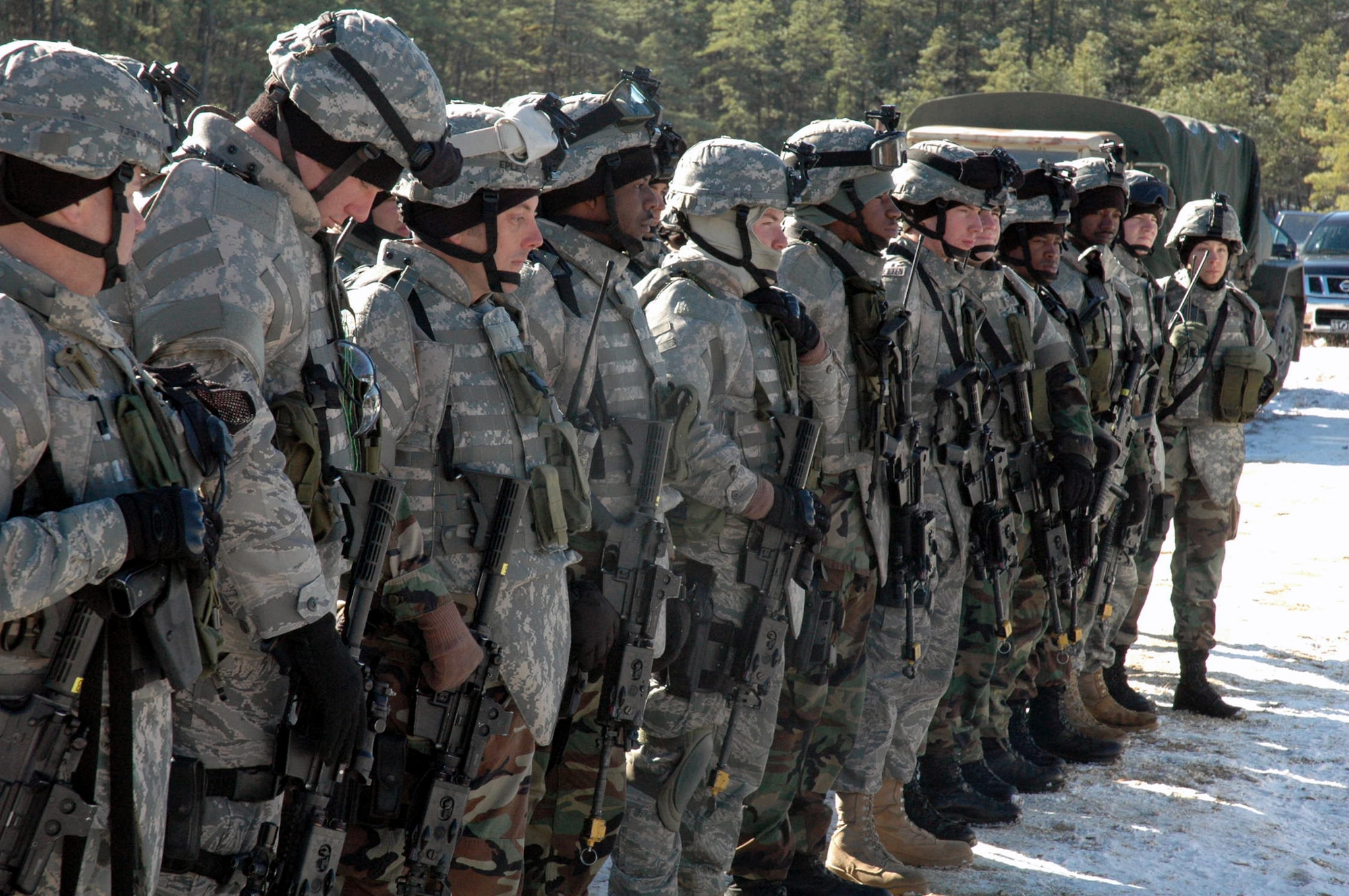 Students in the Tactical Security Element Training Course 08-A prepare for a day of training on a range on Fort Dix, N.J., Dec. 6.  The training was the first of its kind by the U.S. Air Force Expeditionary Center, also from Fort Dix.  Taught with instructors from the Air Force Office of Special Investigations and security forces cadre from the Center's 421st Combat Training Squadron, the training is designed to prepare security forces for "outside the wire" missions with OSI in the deployed environment.  (U.S. Air Force Photo/Tech. Sgt. Scott T. Sturkol)