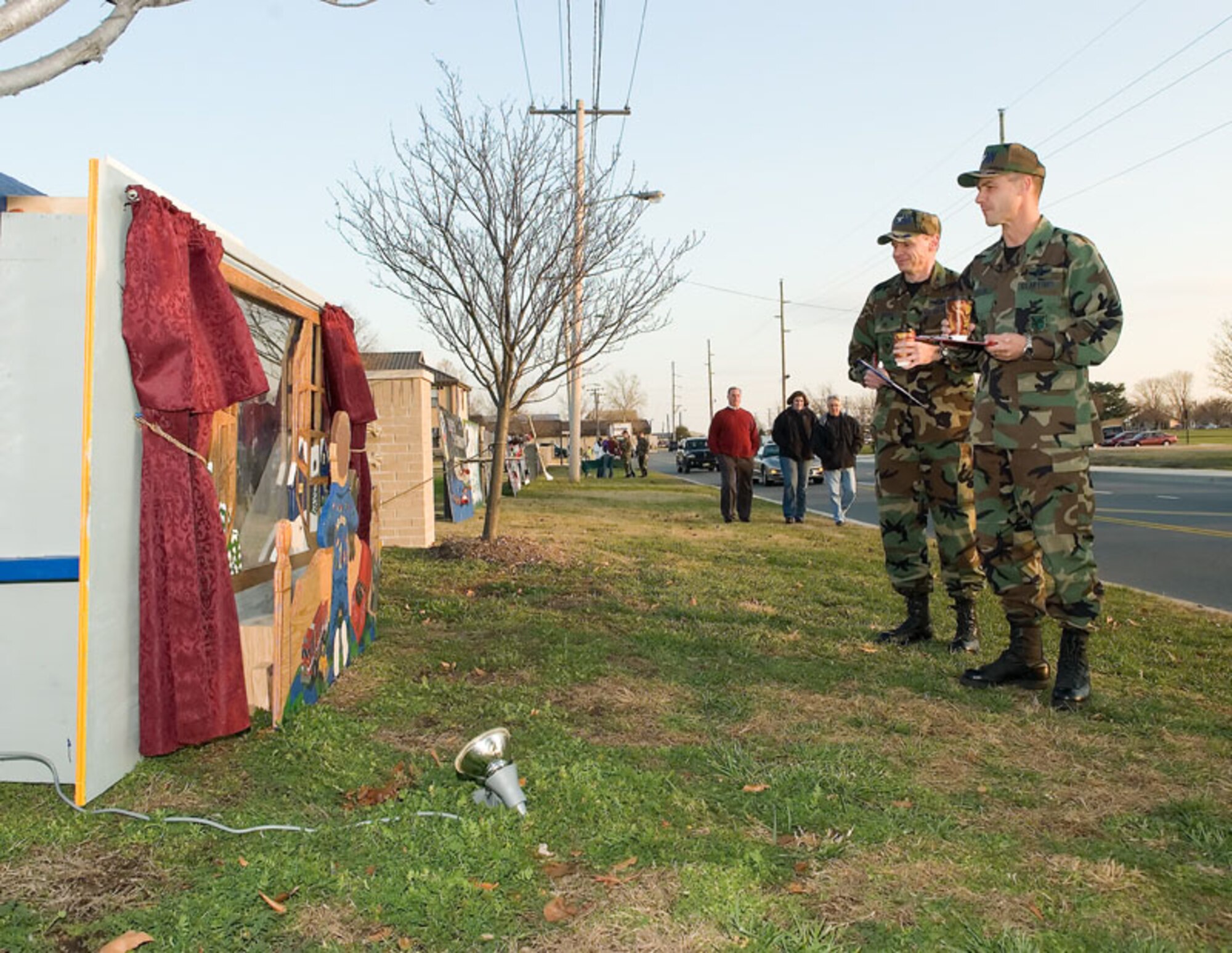 (Left to right) Col. Eric Wydra, 436th Airlift Wing vice commander, and Col. Steven Harrison, 436th AW commander, judge the holiday cards Dec. 14. The winning card was the 436th Civil Engineer Squadron's card.  (U.S. Air Force photo/Jason Minto)