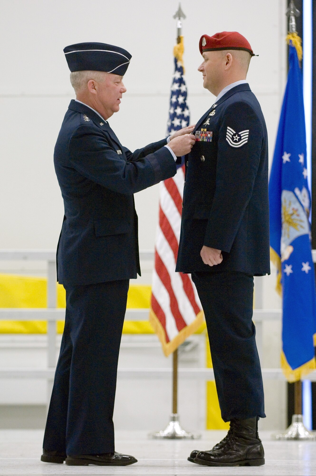 Lt. Gen. Donald C. Wurster pins the Silver Star on Tech. Sgt. Scott Innis during a Dec. 18 medal ceremony at McChord Air Force Base, Wash. General Wurster is the Air Force Special Operations Command commander. Sergeant Innis is assigned to the 22nd Special Tactics Squadron. The Silver Star, the nation's third highest decoration for valor, was presented first to Sergeant Innis for his actions during a firefight with enemy forces in Afghanistan during spring 2006. Sergeant Innis also received a Bronze Star with Valor and an Air Force Combat Action Medal for his actions during his unit's 2007 deployment to Southwest Asia. (U.S. Air Force photo/Abner Guzman) 
