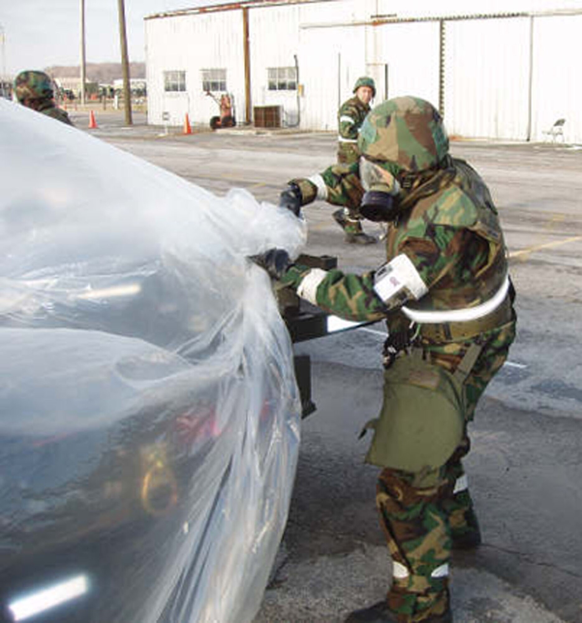 An Airman from the 74th Aerial Port Squadron uncovers a K-Loader after a simulated attack during the recent Operational Readiness Inspection. (U.S. Air Force Courtesy Photo)