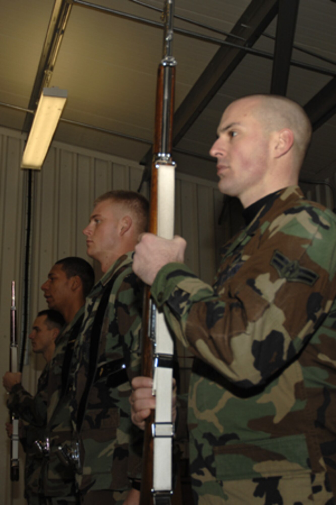 Airmen from the 48th Fighter Wing Honor Guard post in front of the flags during a practice Dec. 20 at RAF Lakenheath. The honor guard practices every Thursday at 3 p.m. (U.S. Air Force photo by Airman Perry Aston)