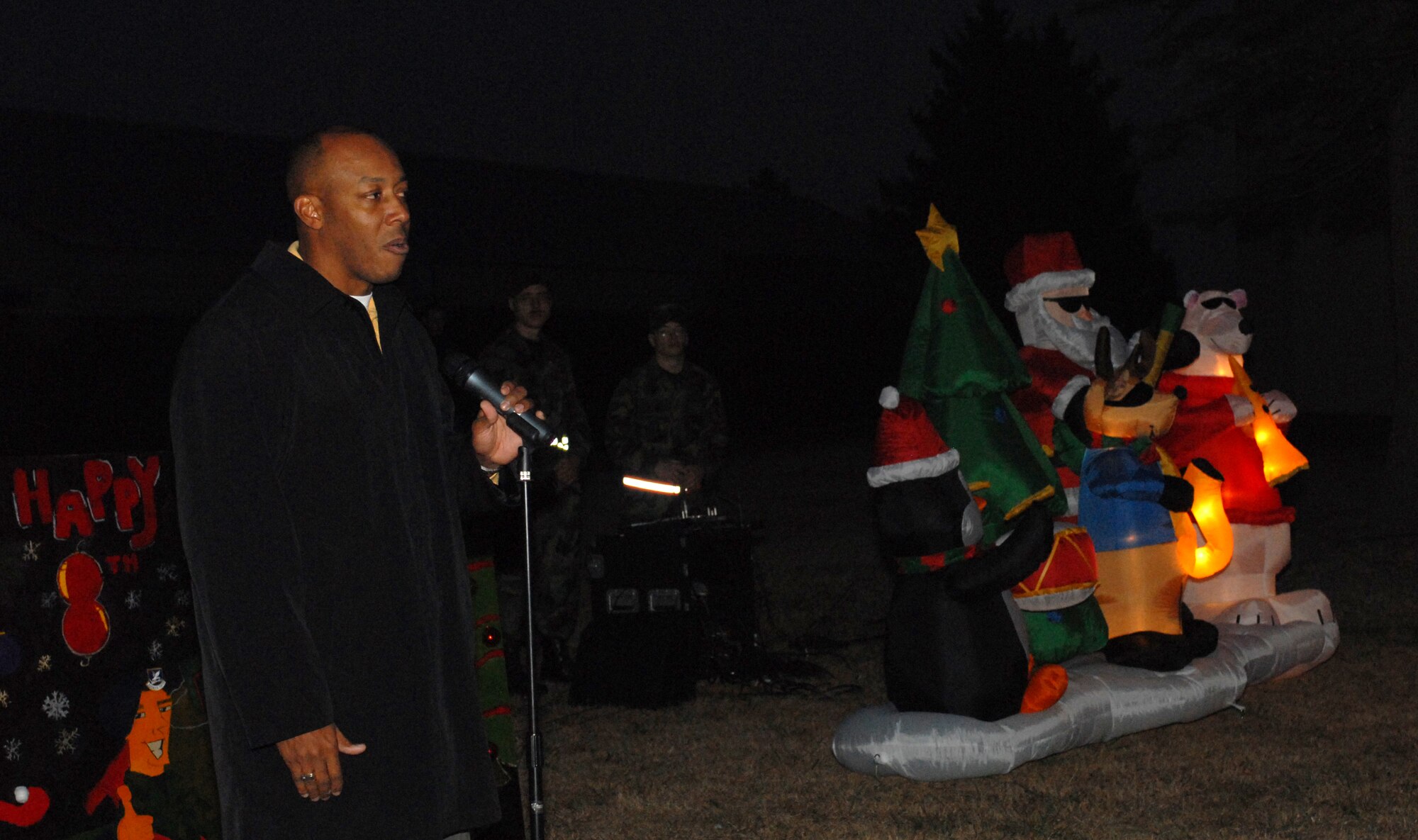 KUNSAN AIR BASE, South Korea -- Col. CQ "Wolf" Brown, 8th Fighter Wing commander, delivers an opening speech during the Holiday Lighting ceremony here Dec. 21. The lighting ceremony is an annual event held to help boost morale during the holiday season. (U.S. Air Force photo/Senior Airman Giang Nguyen)
