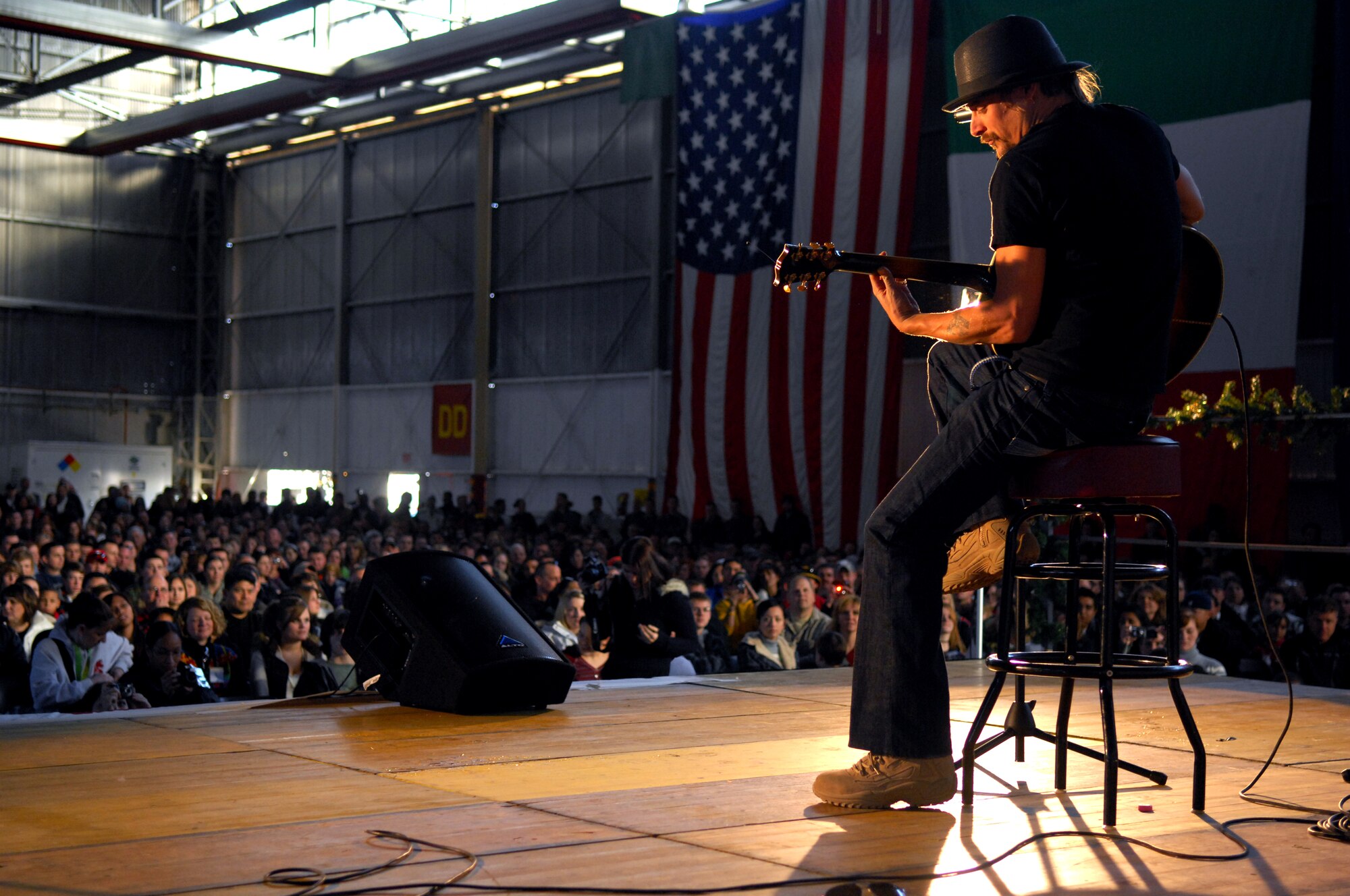 AVIANO AIR BASE, Italy--  "Rock Star" Kid Rock performs as part of a USO holiday show held for the Aviano community, Dec. 22, 2007.  Navy Adm. Michael G. Mullen, chairman of the Joint Chiefs of Staff, arrived in Aviano early Saturday afternoon from down range, bringing entertainers and celebrities Robin Williams, Lewis Black, Kid Rock, Lance Armstrong, Rachel Smith, the reigning Miss USA, and Ronan Tynan an Irish Tennor on the Chairman's United Service Organizations Holiday tour.  (U.S. Air Force photo/Staff Sgt. Michael R. Holzworth) 