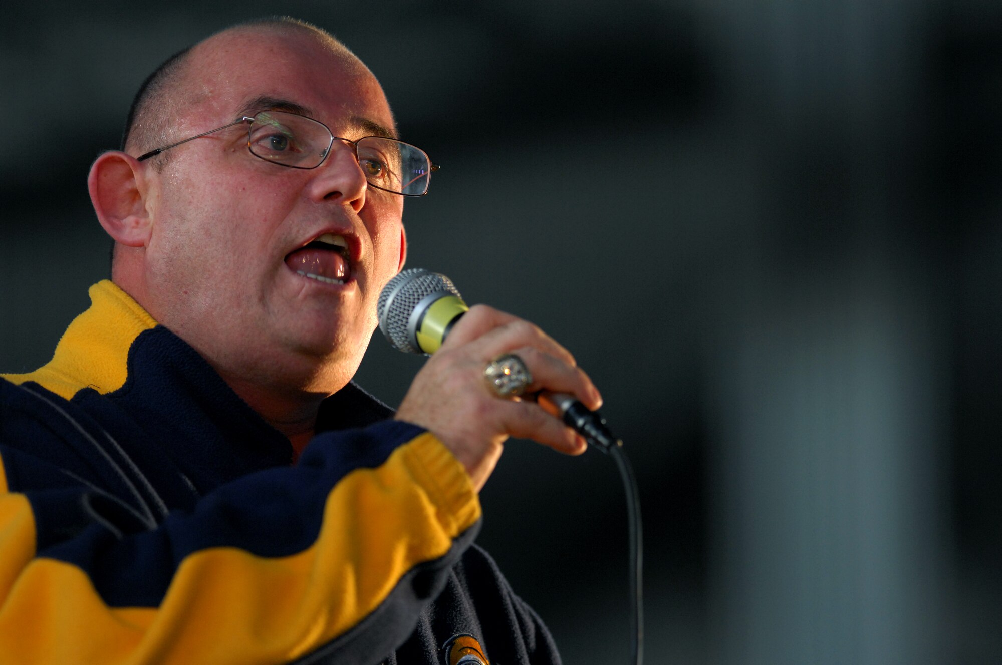 AVAINO AIR BASE, Italy-- Ronan Tynan an Irish Tennor sings Amazing grace during a USO holiday show held for the Aviano community Dec. 22, 2007.  Navy Adm. Michael G. Mullen, chairman of the Joint Chiefs of Staff, arrived in Aviano early Saturday afternoon from down range, bringing entertainers and celebrities Robin Williams, Lewis Black, Kid Rock, Lance Armstrong, Rachel Smith, the reigning Miss USA, and Ronan Tynan an Irish Tennor on the Chairman's United Service Organizations Holiday tour.  (U.S. Air Force photo/Staff Sgt. Michael R. Holzworth) 