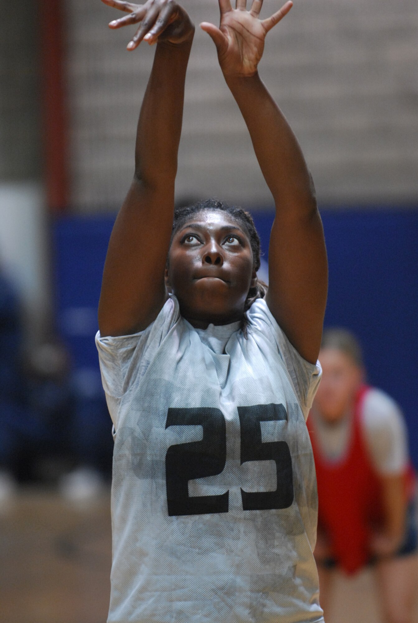 SOUTHWEST ASIA - Staff Sgt. Carmeisha Layton, 379th Expeditionary Logistics Readiness Squadron/Civil Engineer Squadron women's basketball team member, shoots a free throw Dec. 17 during a women's basketball game at a Southwest Asia air base Dec. 17. The 379th Expeditionary Security Forces Squadron beat the 379th ELRS/CES 48 - 40. Sergeant Layton is deployed from Holloman Air Force Base, N. M. (U. S. Air Force photo/Staff Sgt. Douglas  Olsen)
