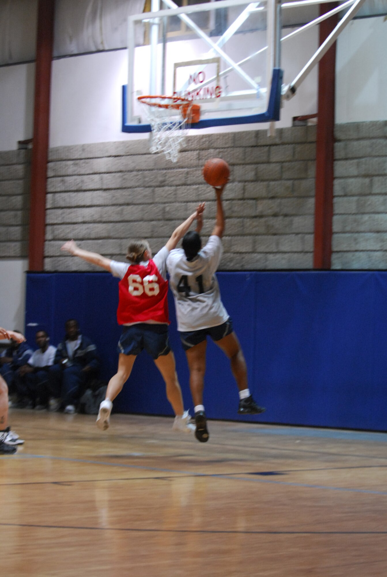 SOUTHWEST ASIA - Tech. Sgt. Sabrina Foster, goes up for a layup as a member of the 379th Expeditionary Security Forces Squadron team tries to defend the shot Dec. 17 during a women's basketball game at a base in Southwest Asia. Sergeant Foster is deployed from Scott Air Force Base, Ill. (U.S. Air Force photo by Staff Sgt. Douglas Olsen)